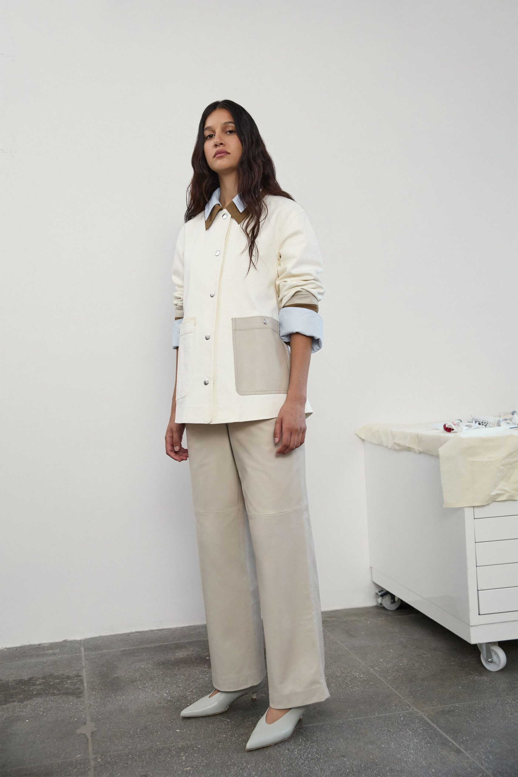 relaxed white jacket with beige pants