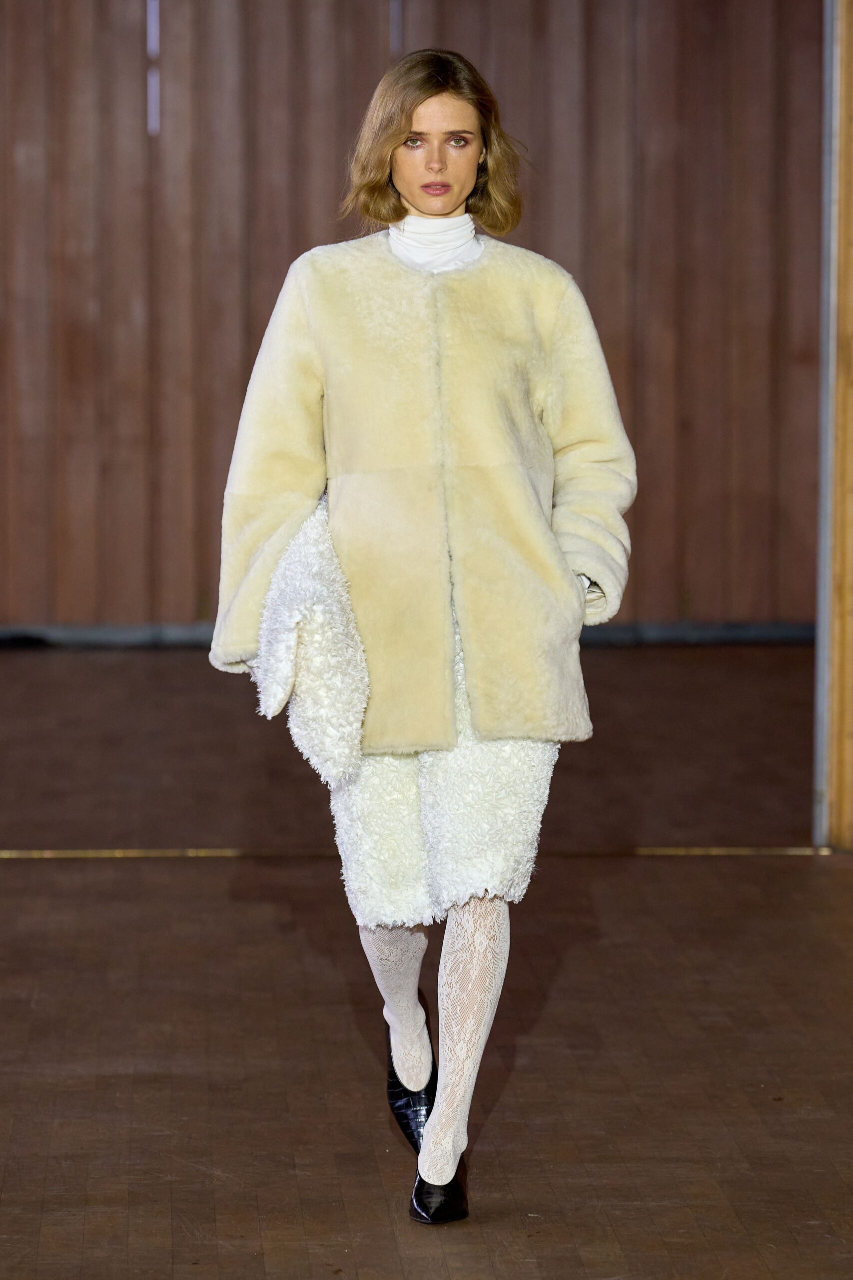 beige fur coat white lace dress