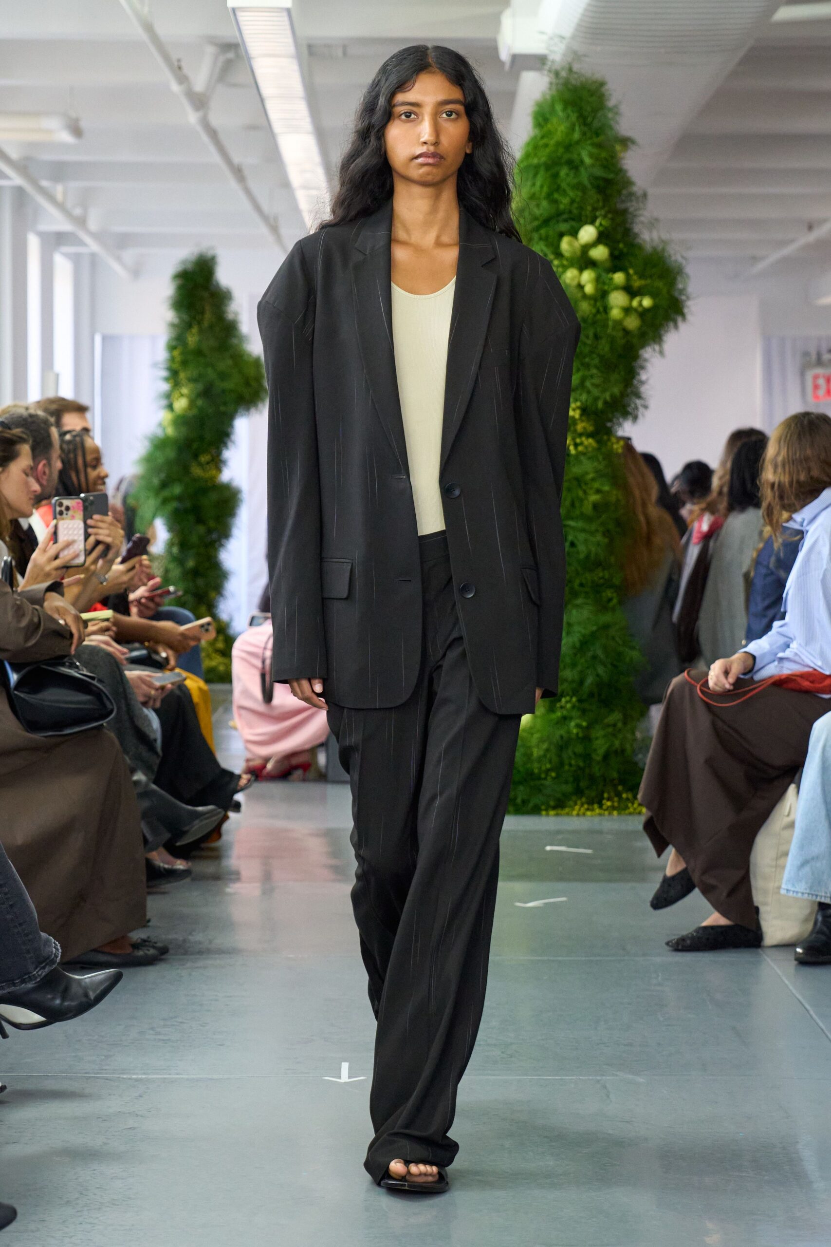 black tailored blazer with beige top