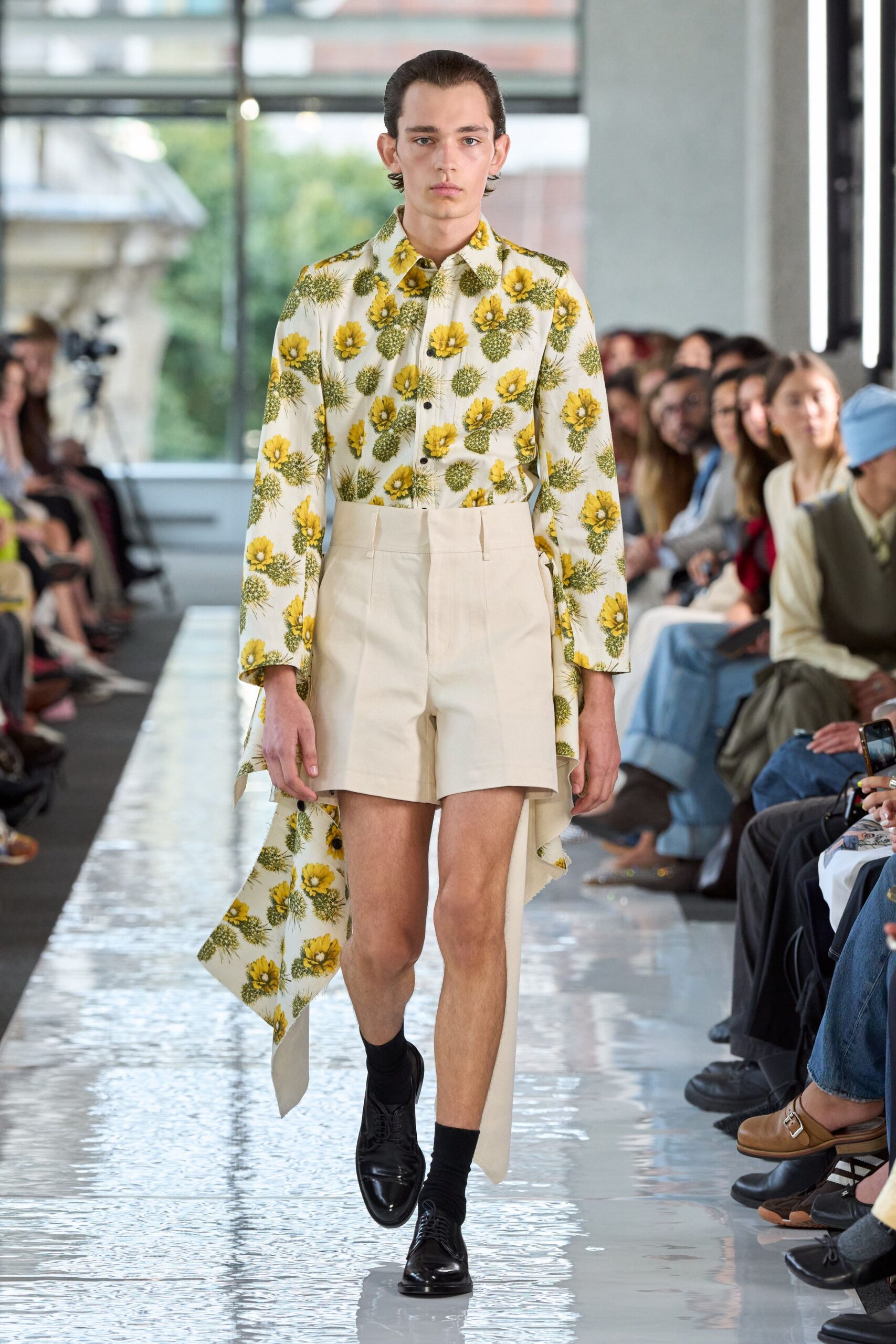 floral shirt and beige shorts