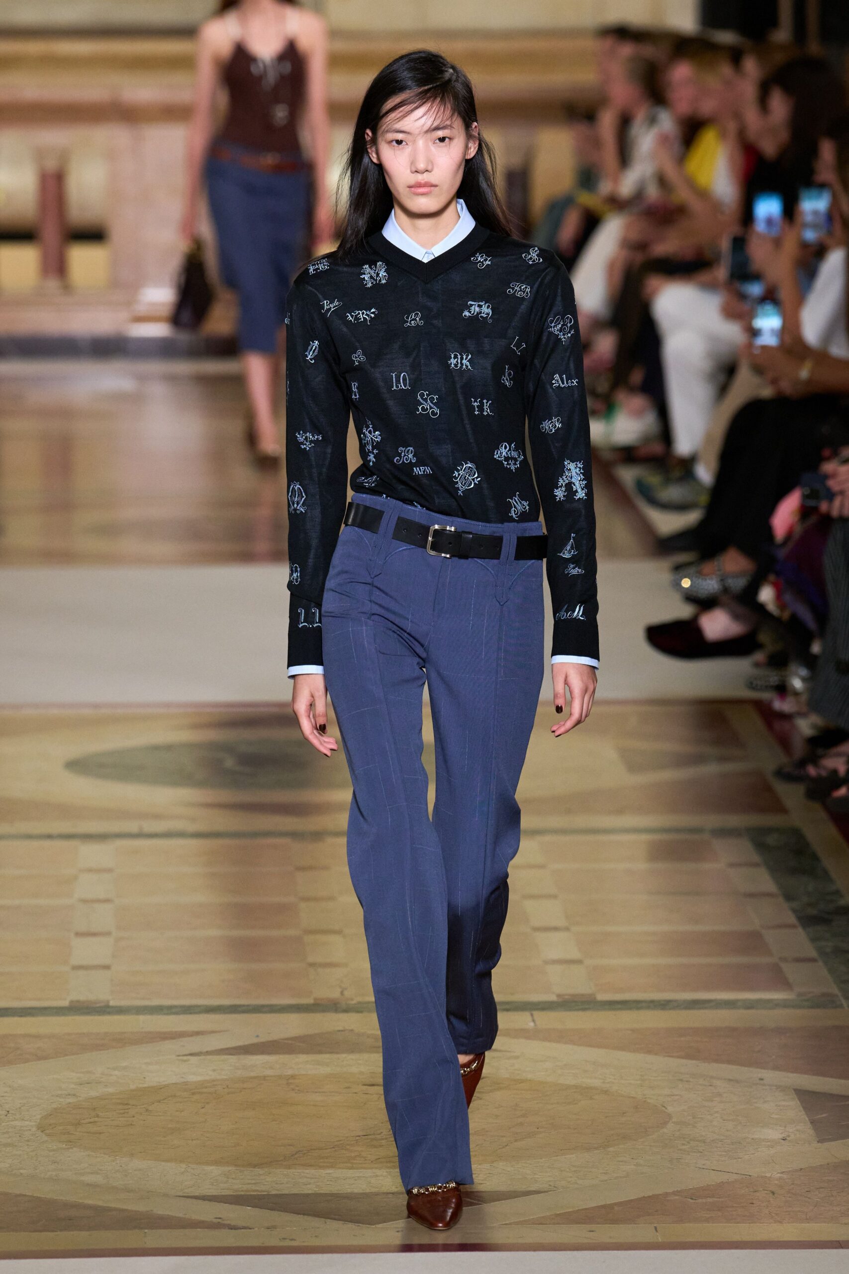 black embroidered top with blue pants