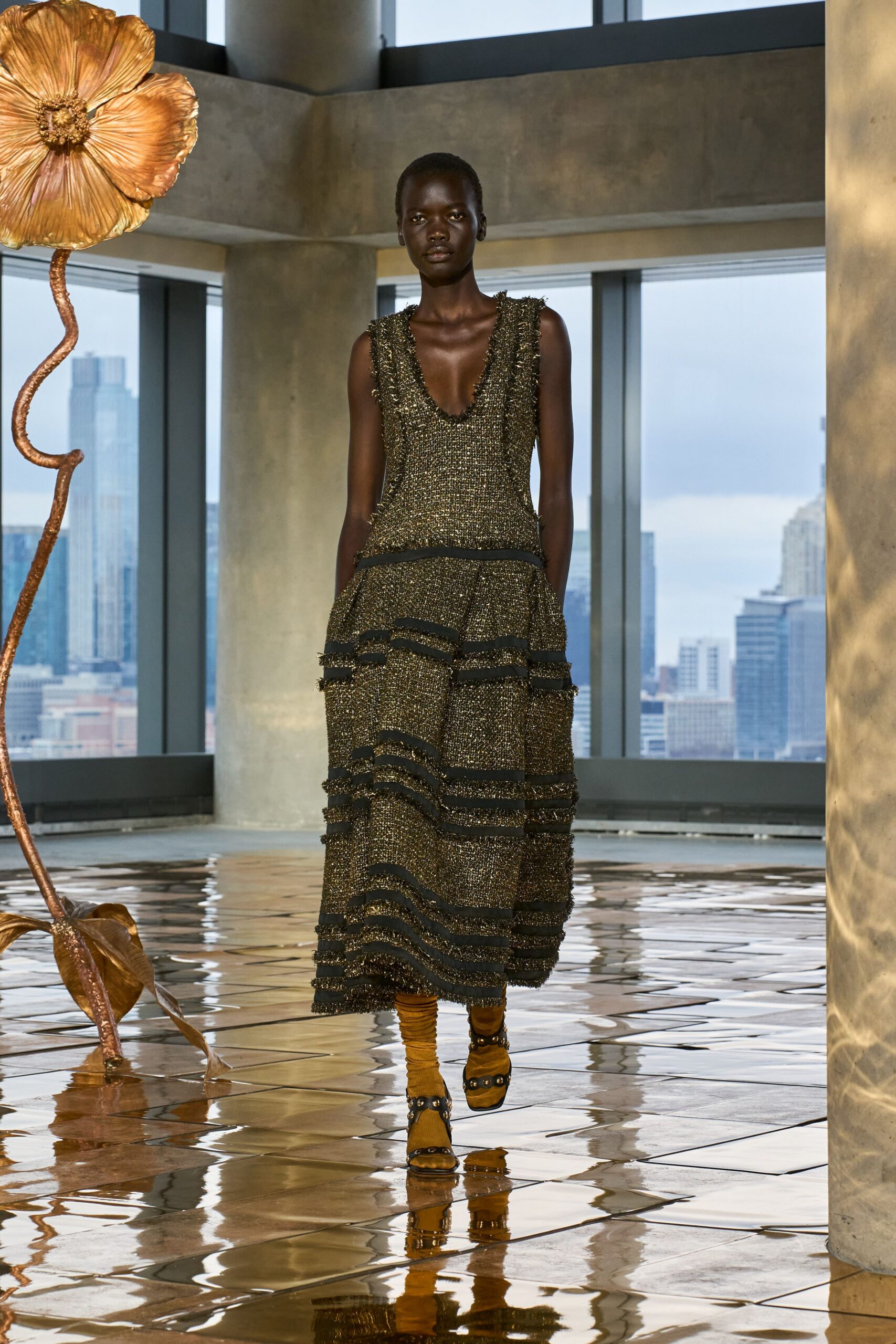 black and gold midi dress with strappy shoes