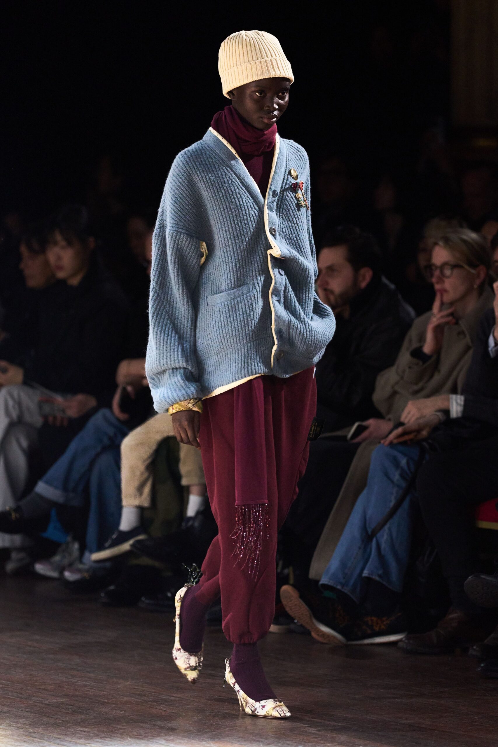 blue wool cardigan with red pants