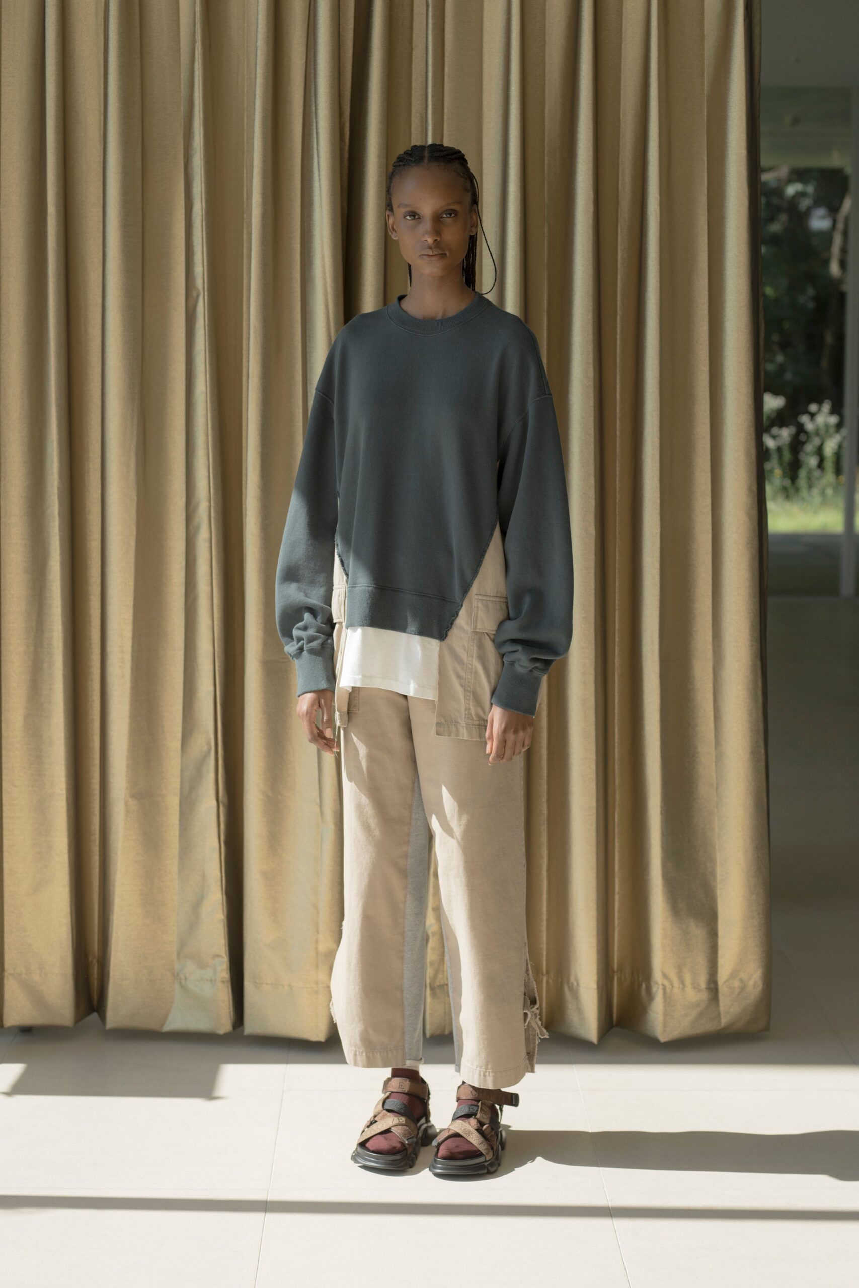 gray relaxed sweater with beige pants