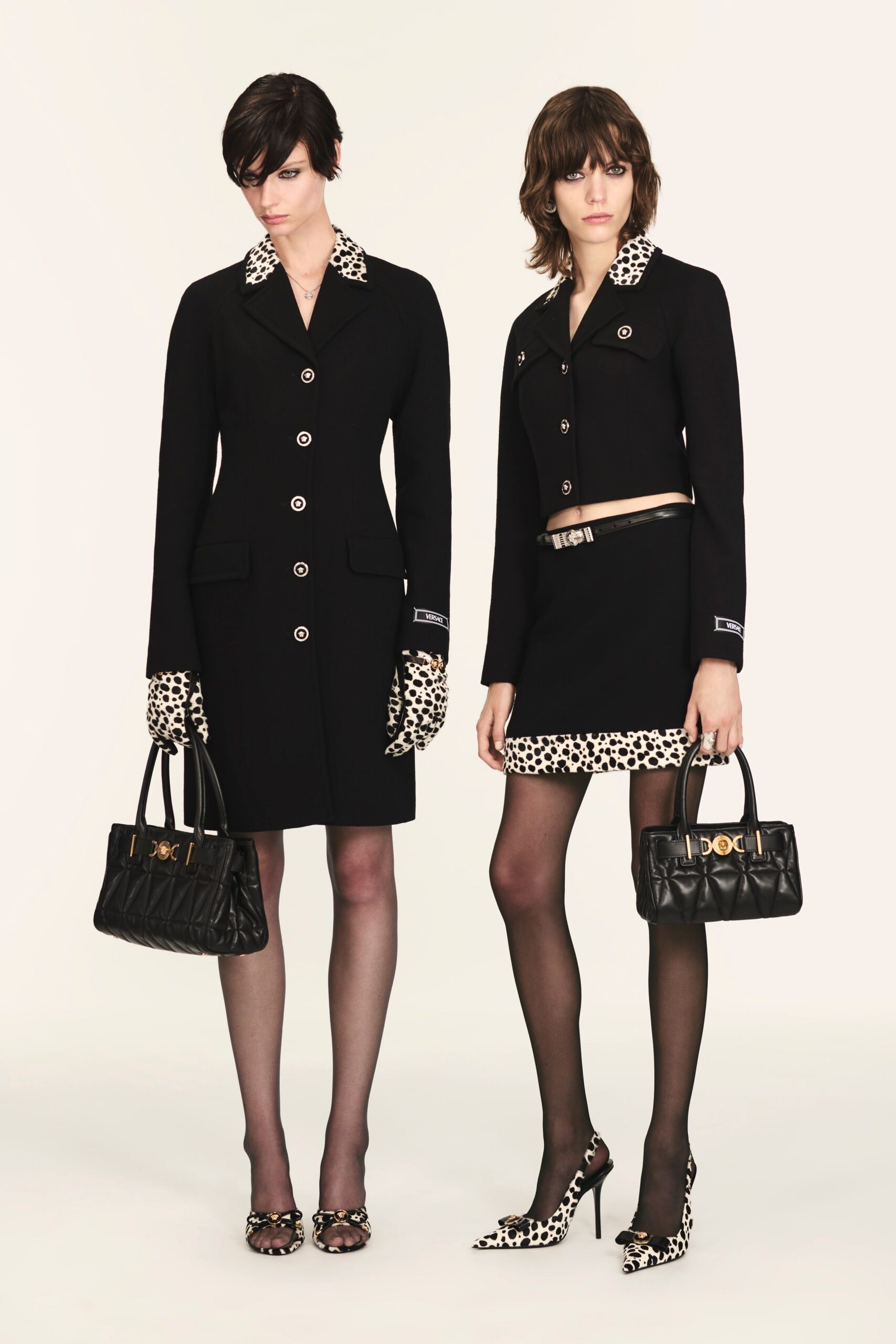 black fitted coat and mini skirt