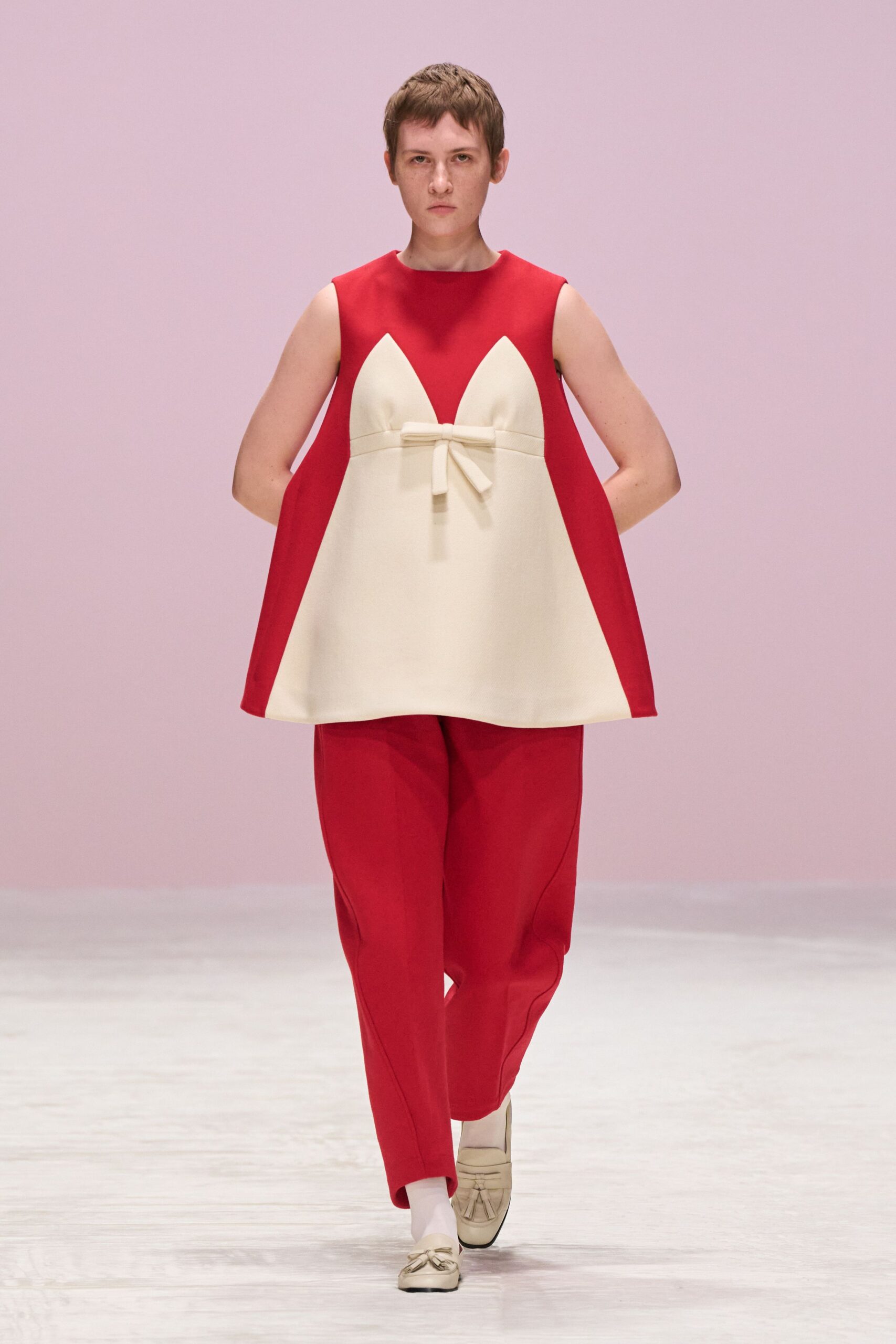 red sleeveless high-neck relaxed pleated top