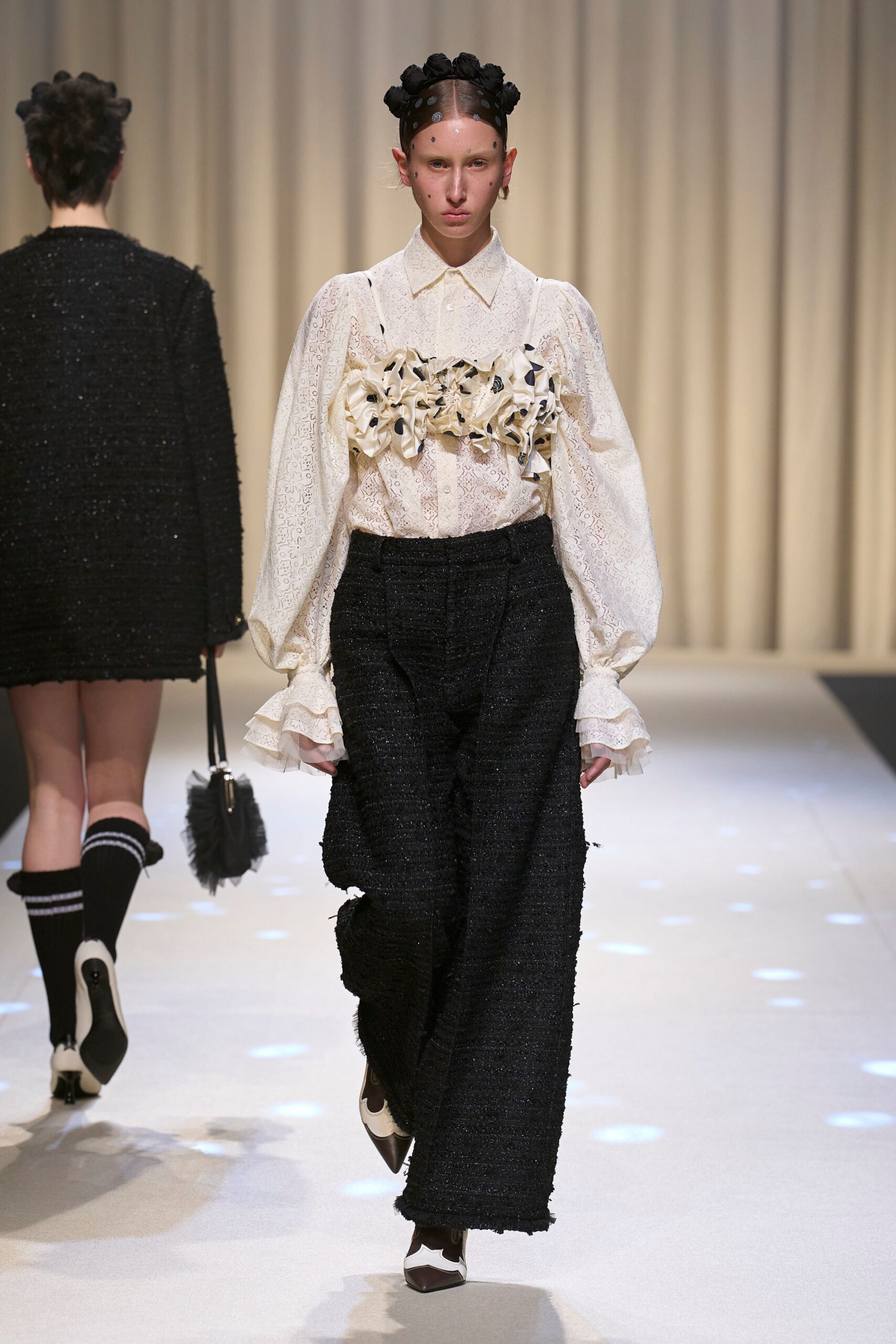 white relaxed shirt with black pants