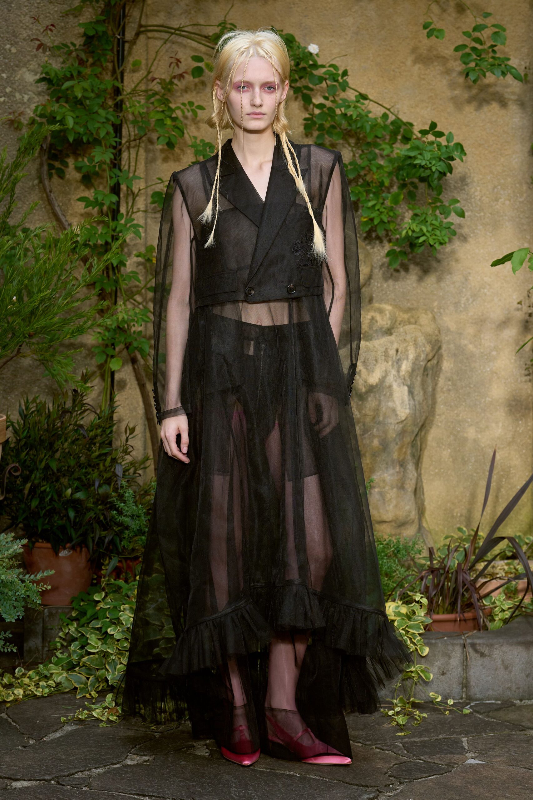 black sheer gown with pink shoes