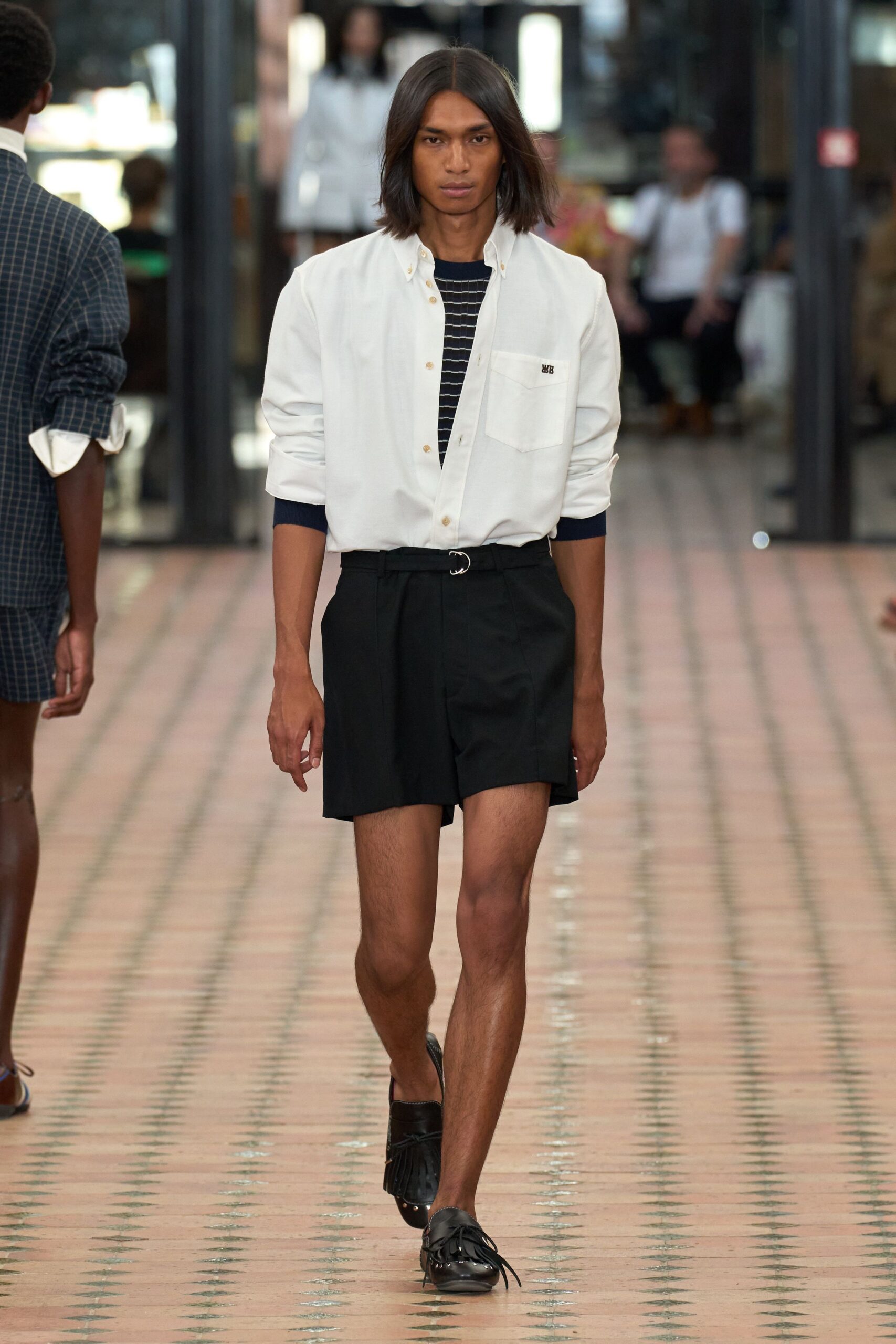 white relaxed shirt black shorts