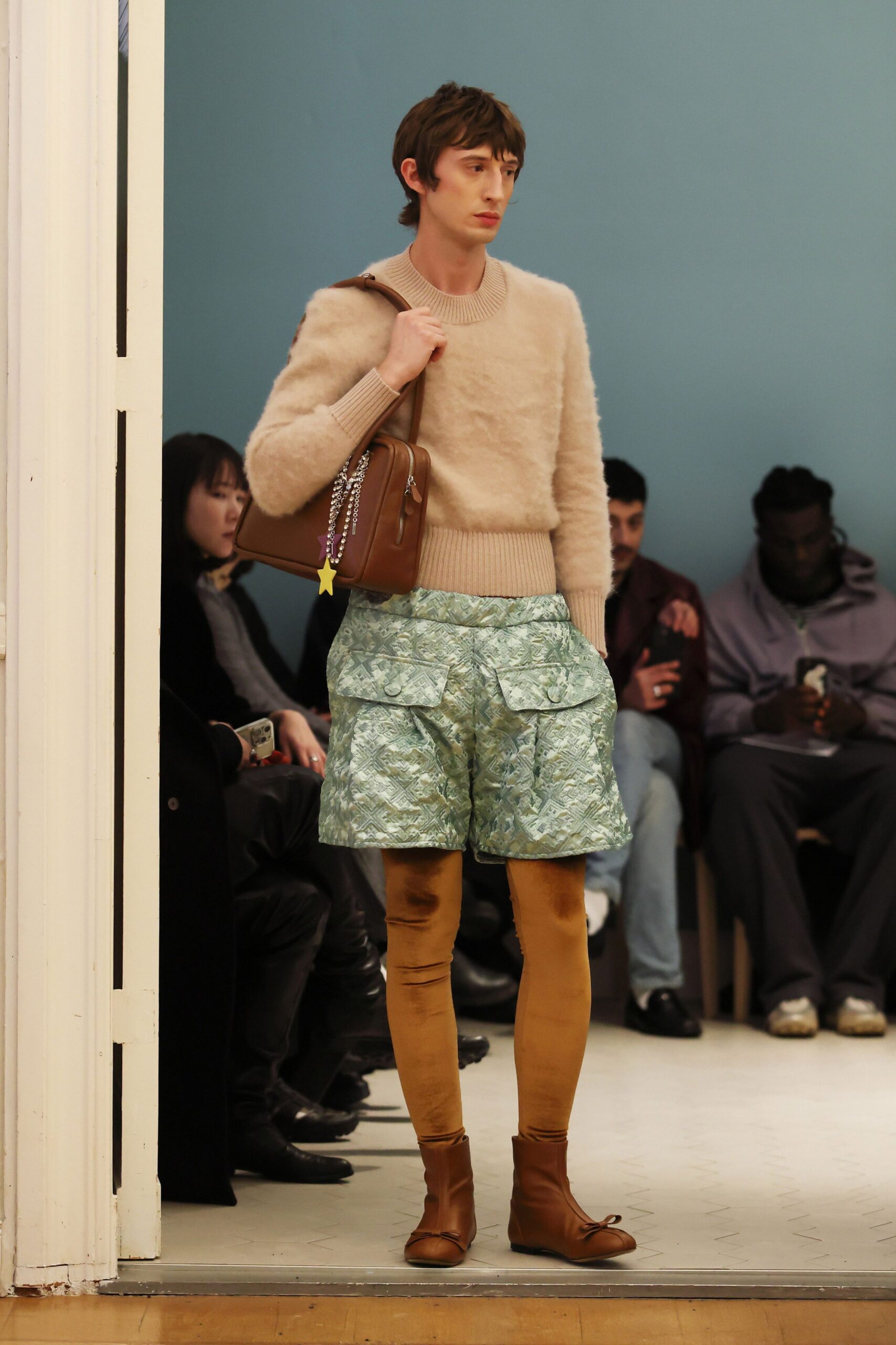 beige wool sweater with green shorts
