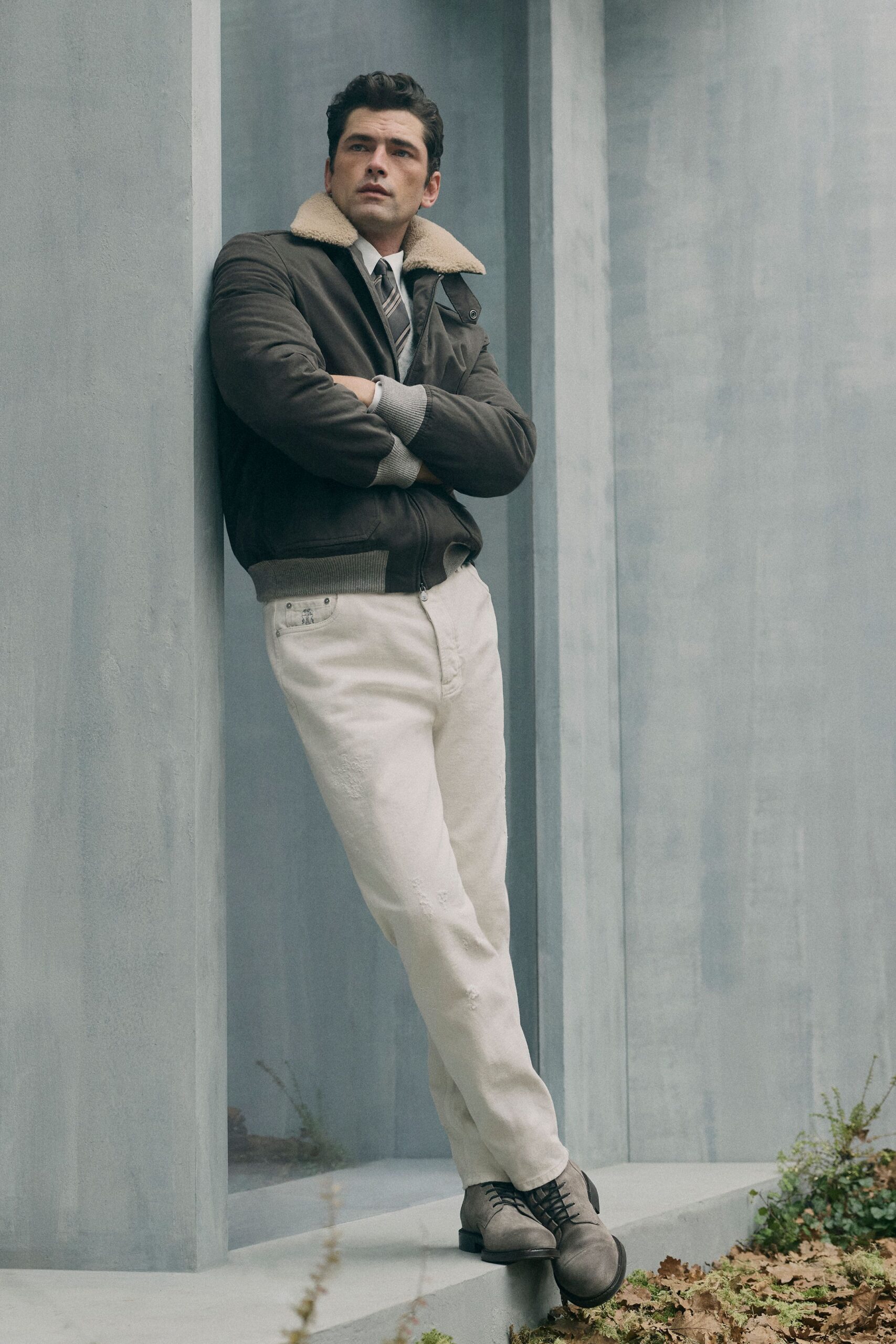 brown jacket white pants gray shoes
