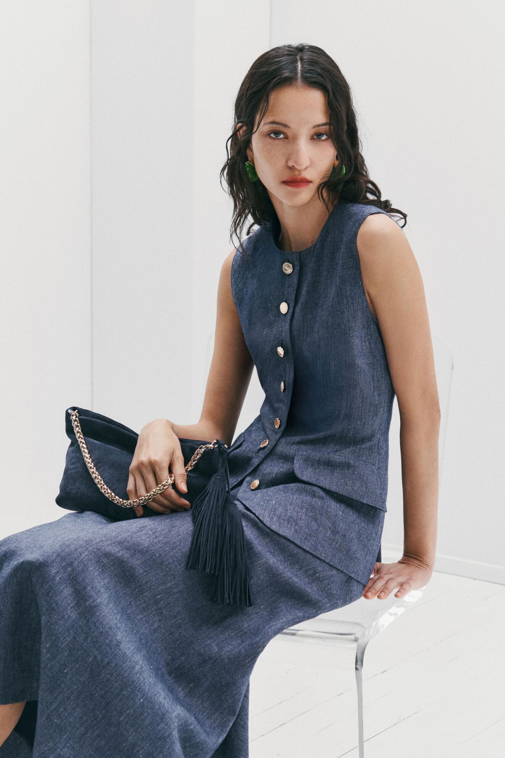 blue cotton sleeveless dress with black bag