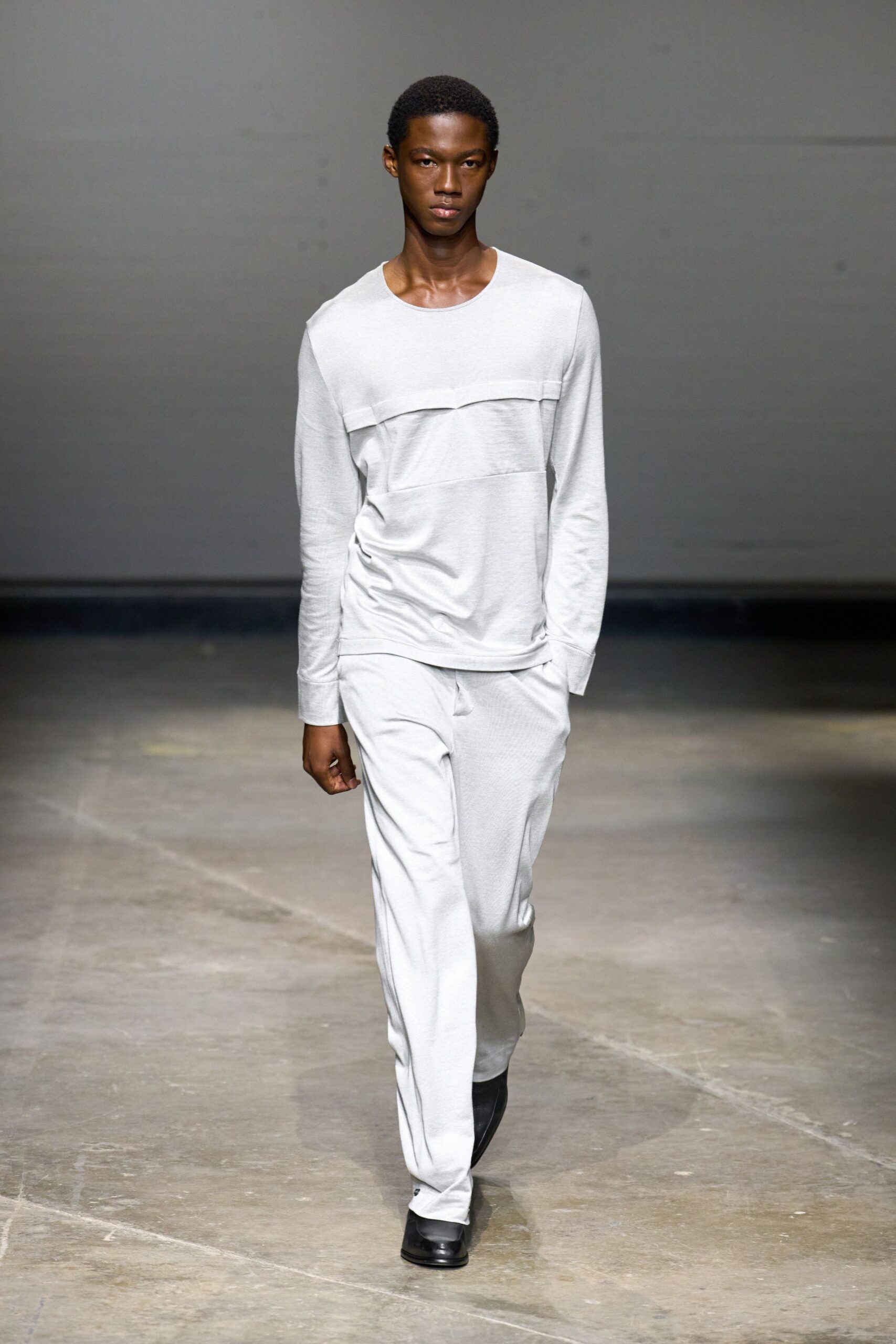 white relaxed top gray pants