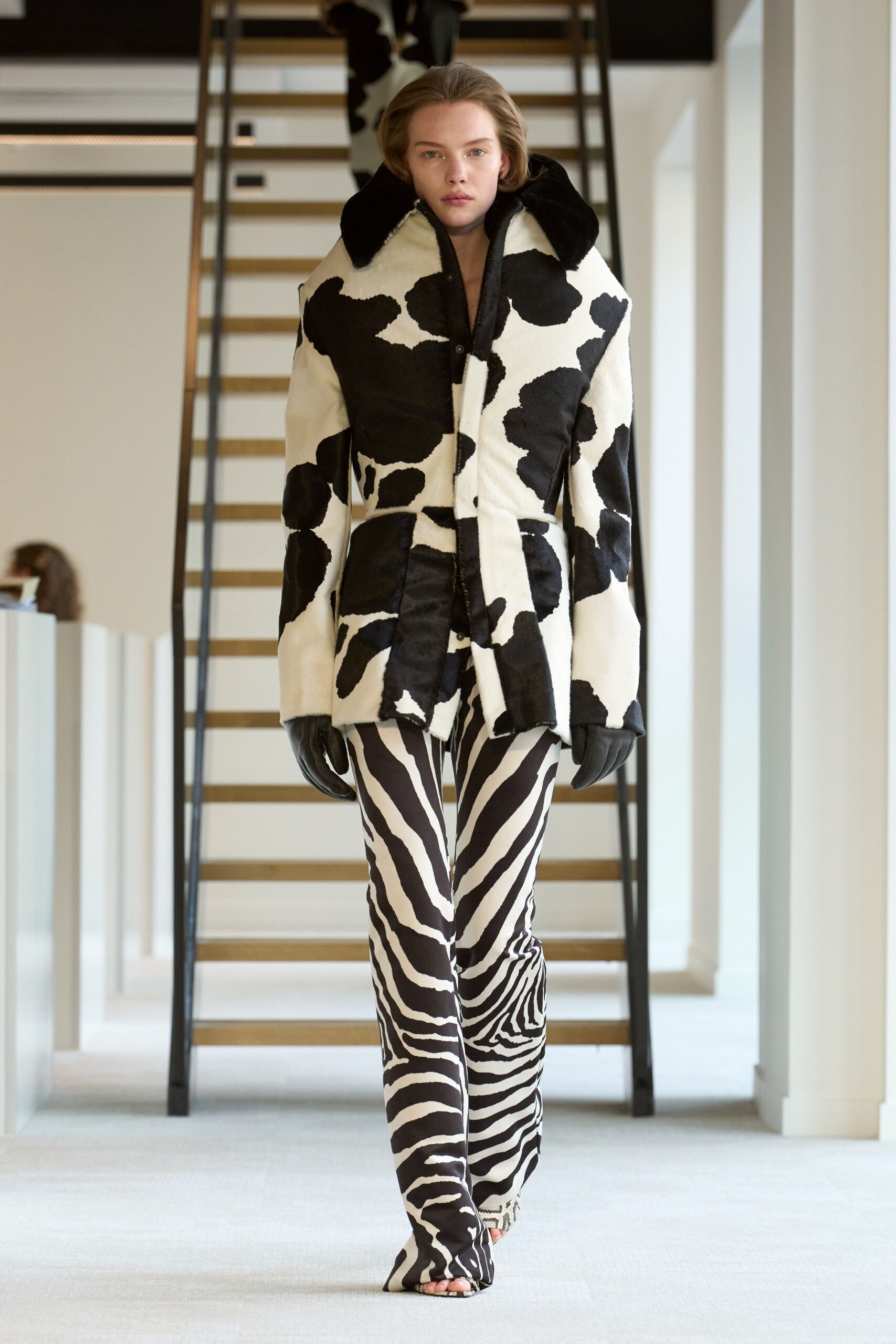 black and white fur coat with striped pants