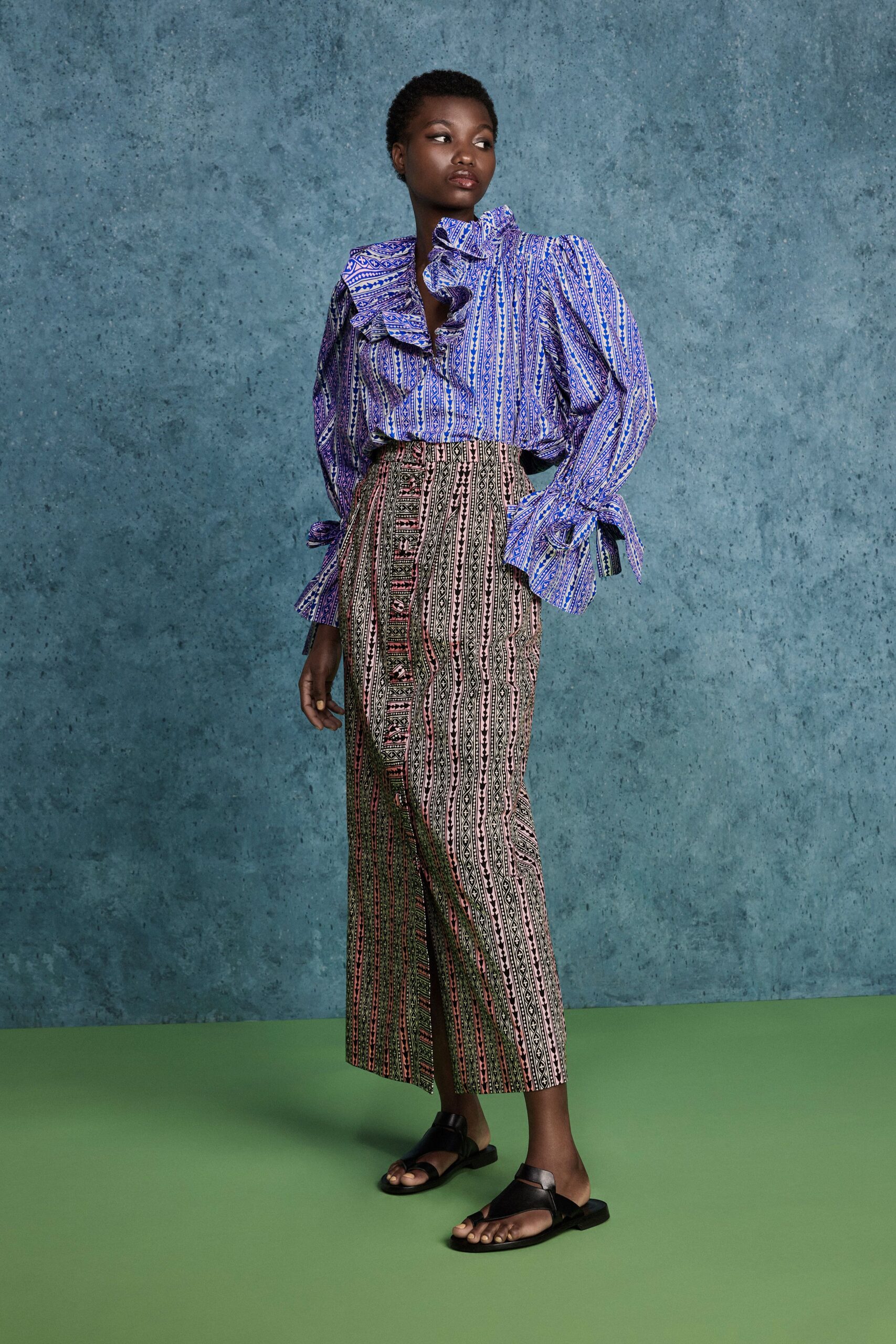 blue cotton long-sleeve collared fitted ruffled printed blouse
