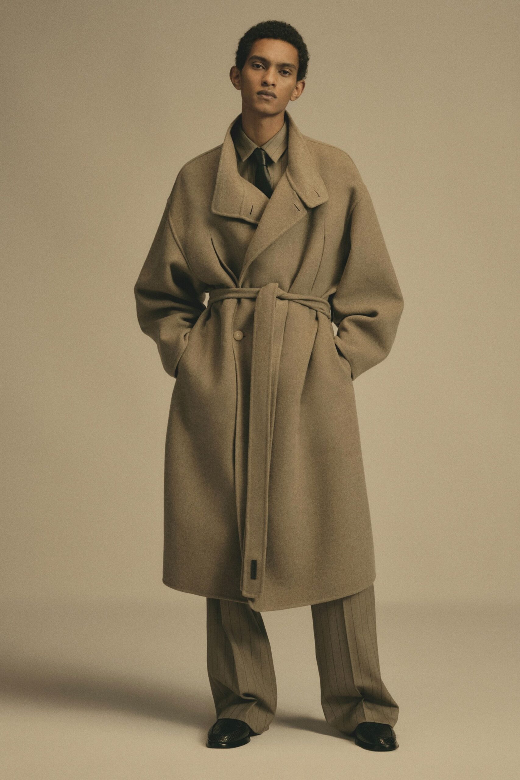 beige oversized coat with tailored pants