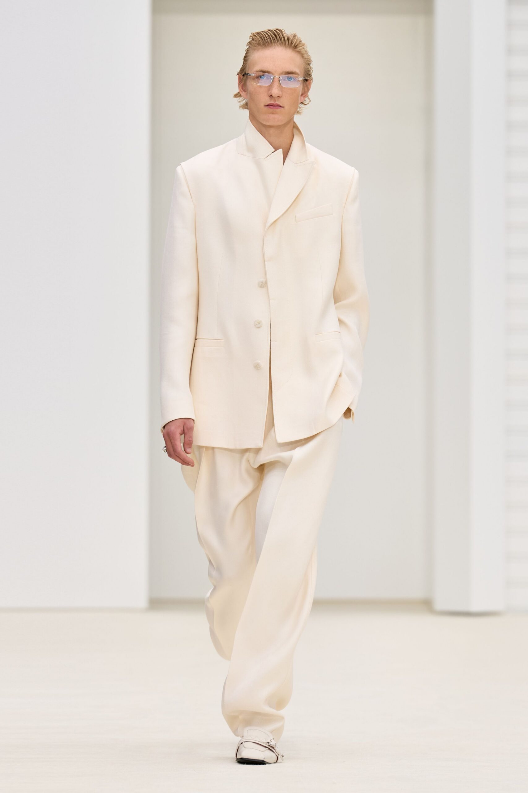 white relaxed suit with sunglasses