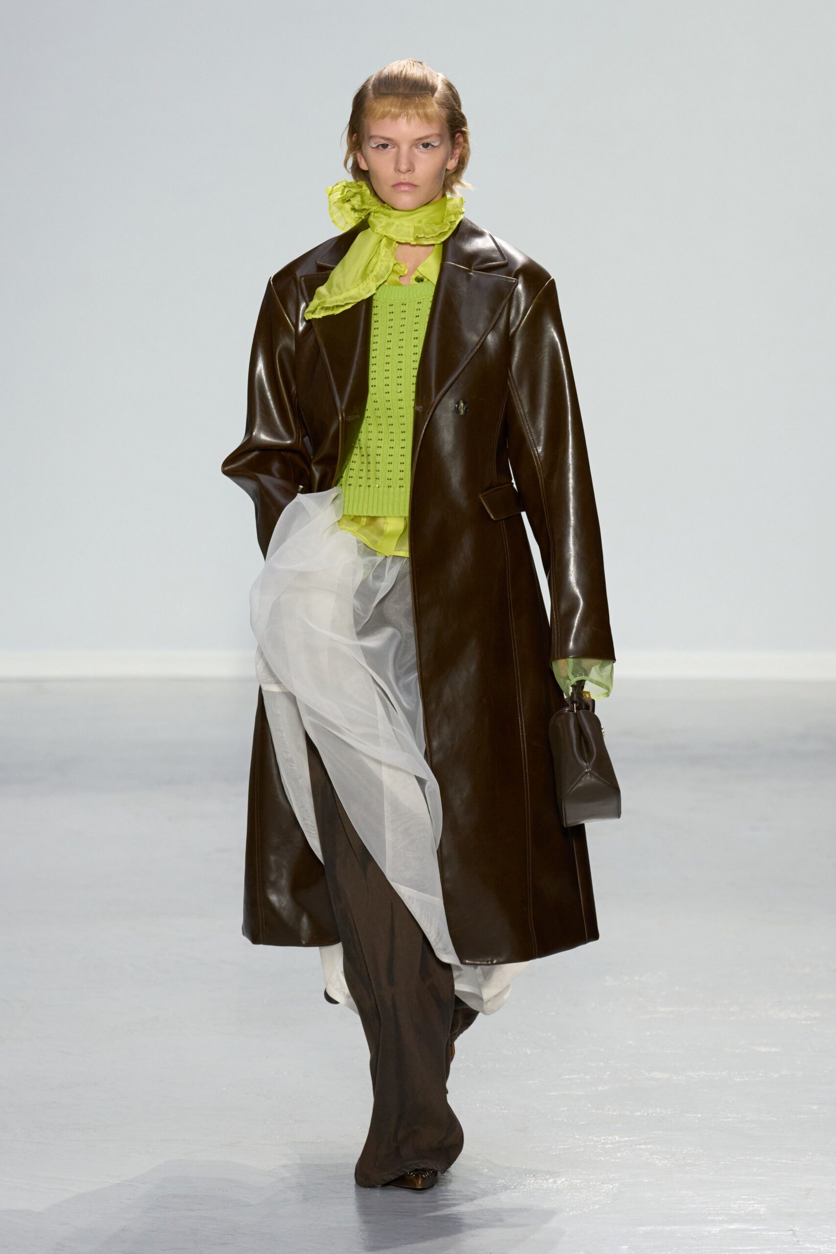 brown leather coat with green top