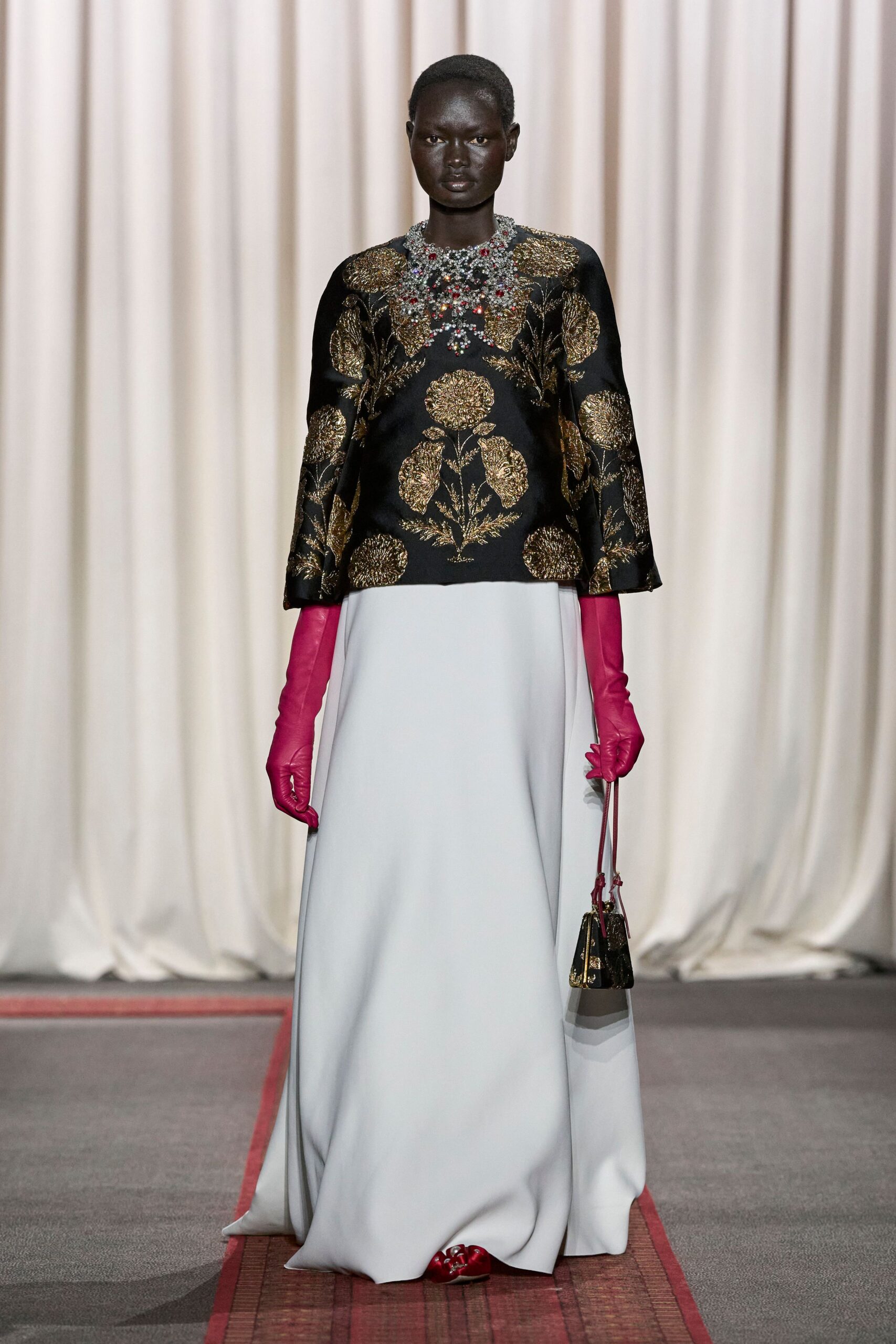black gold embroidered top with white gown