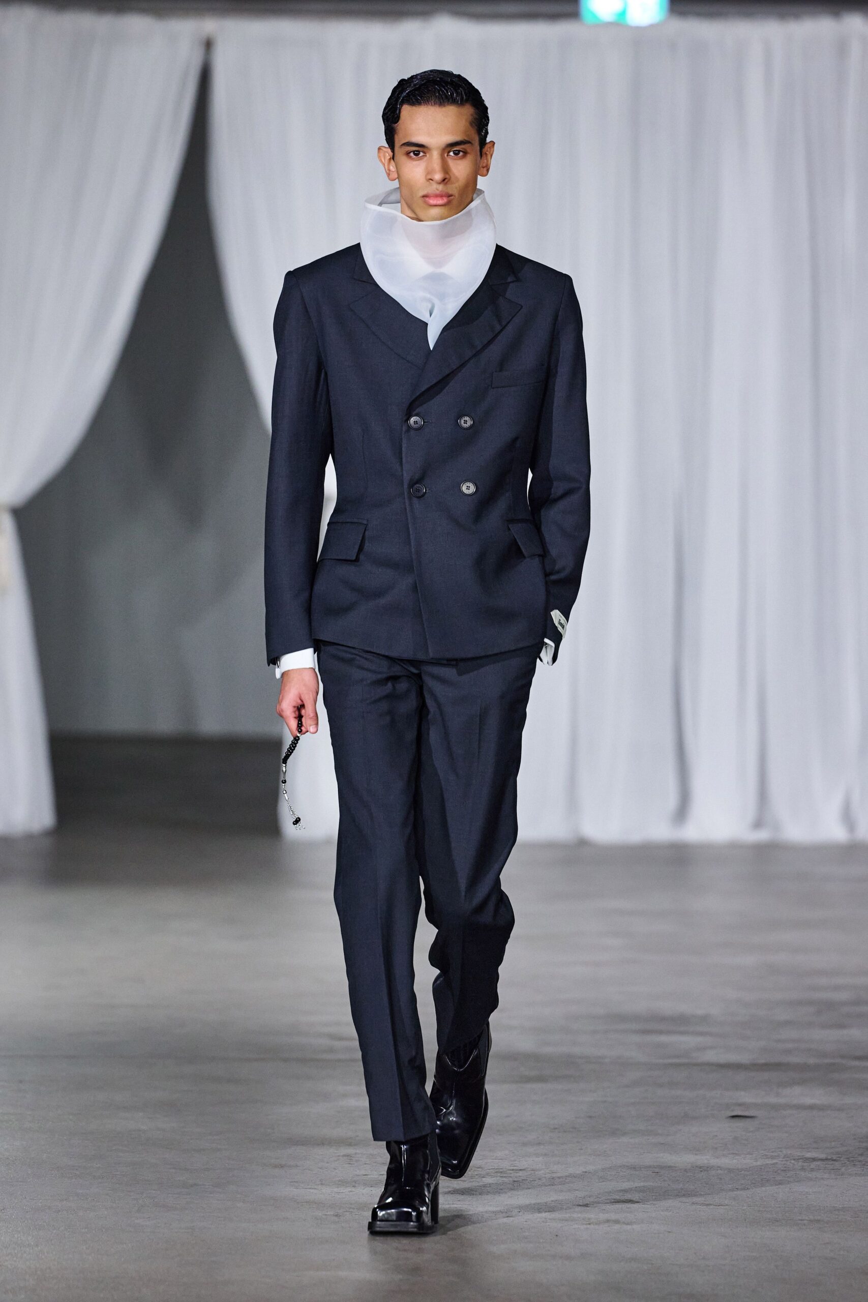 black tailored suit with white shirt