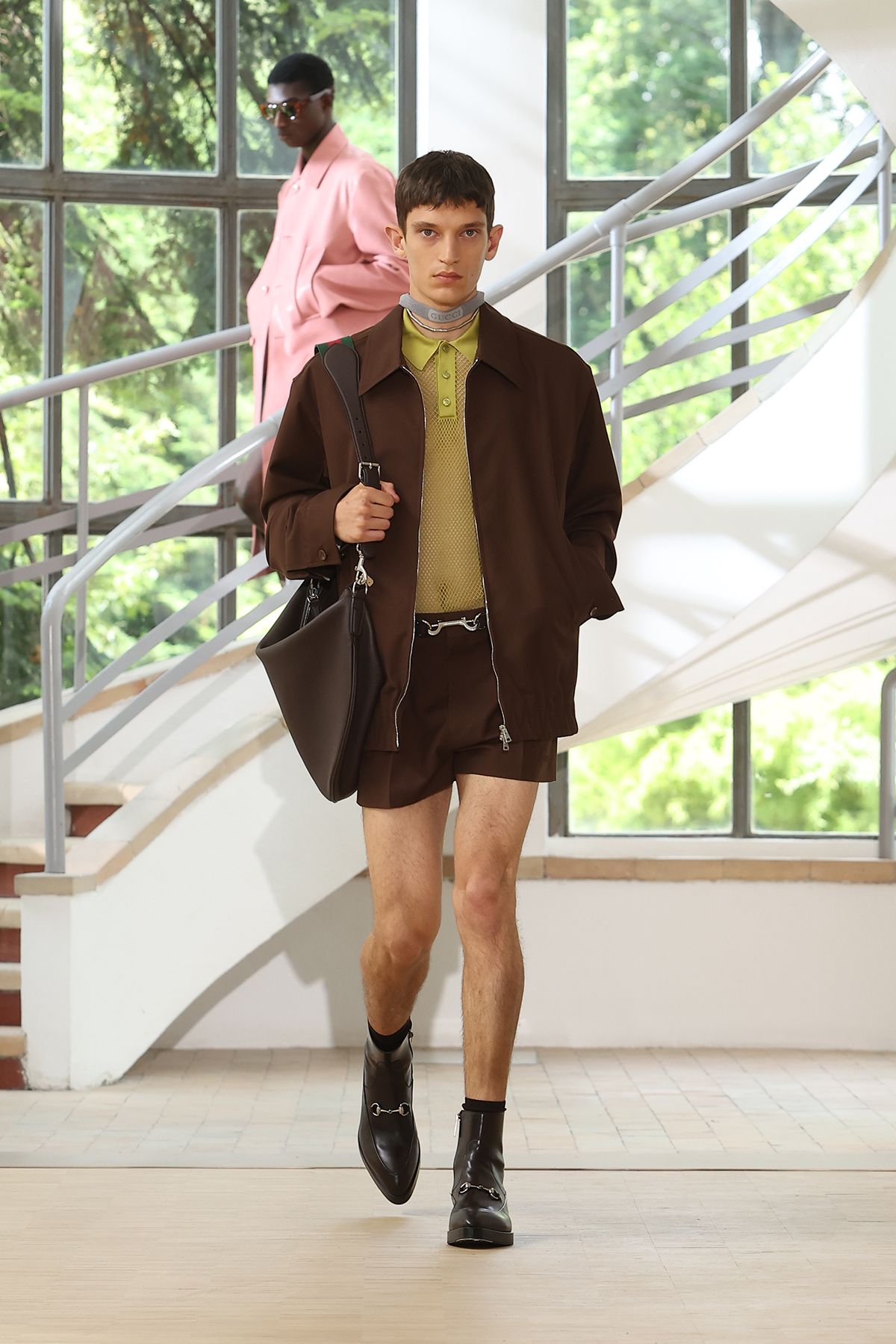 brown jacket green shirt brown shorts