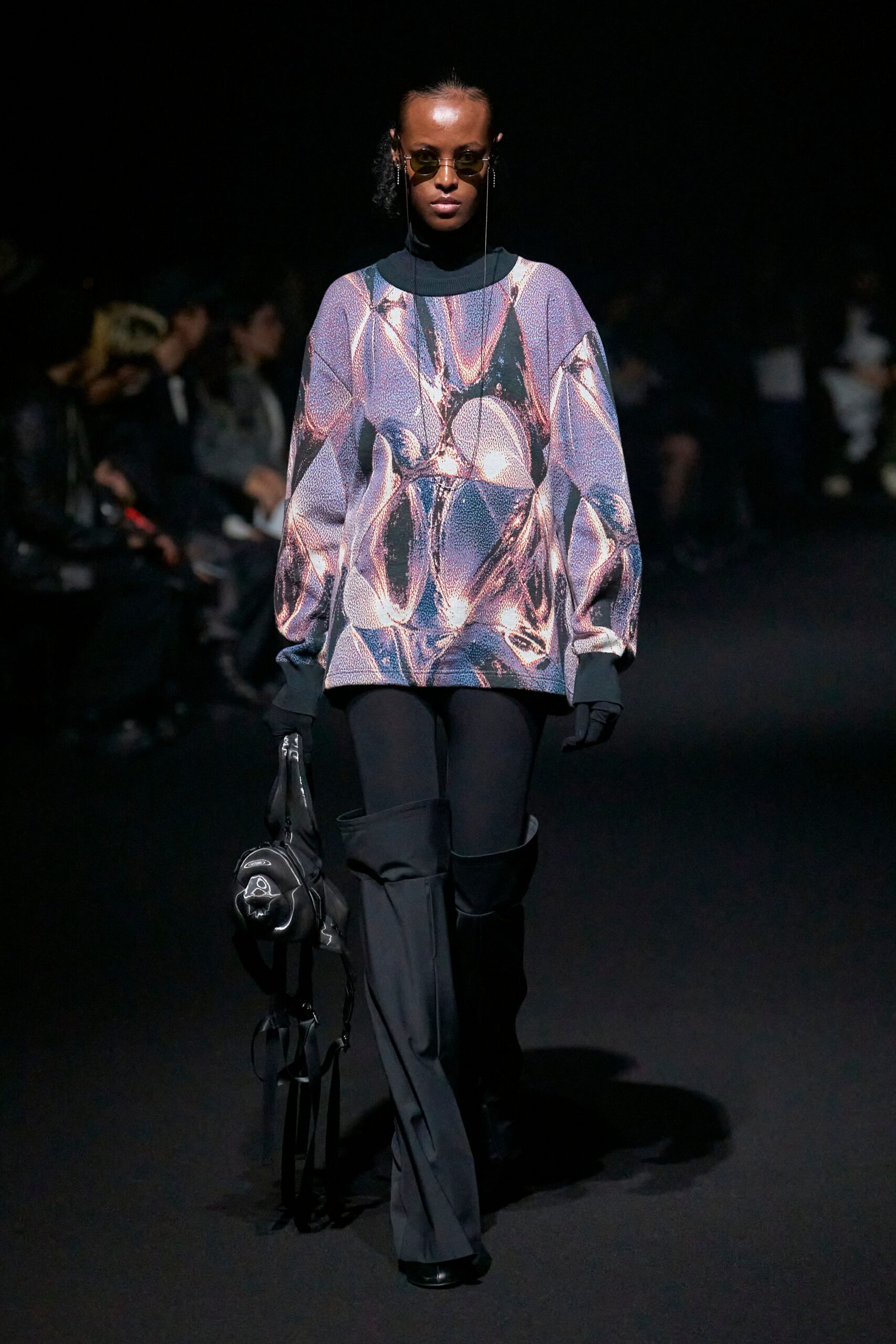 purple textured top with black pants