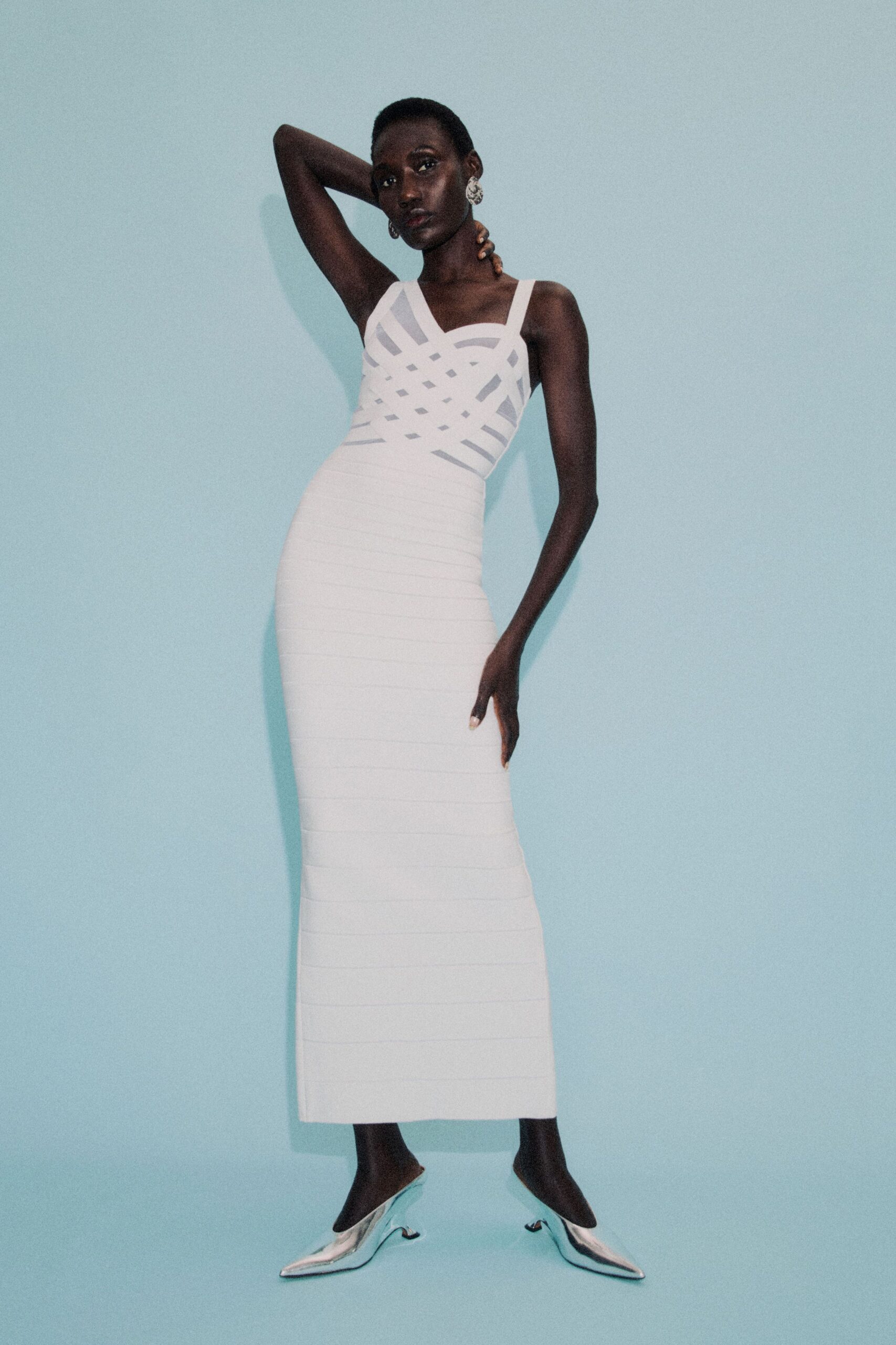 white fitted maxi dress with silver shoes