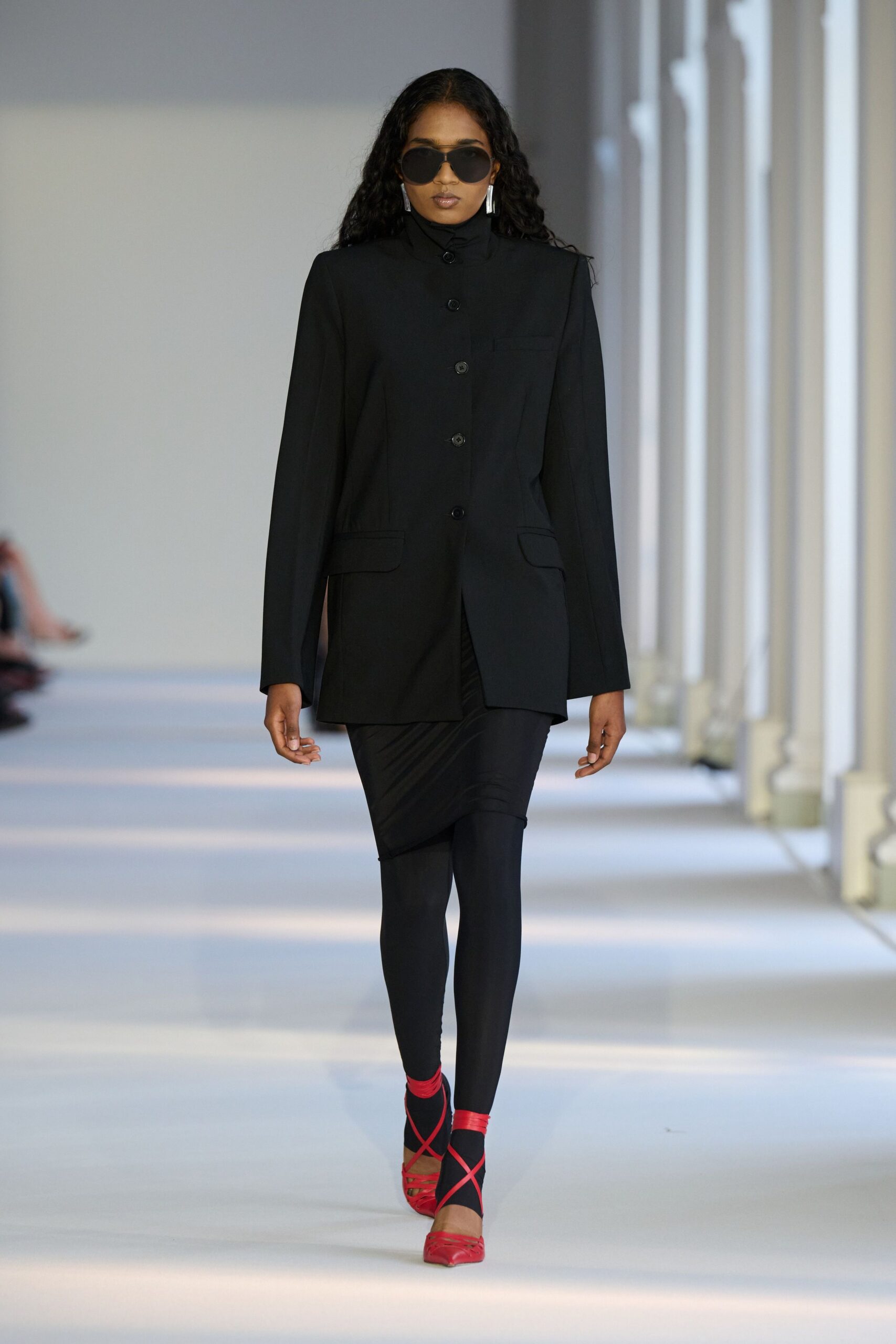 black blazer with leggings and red shoes
