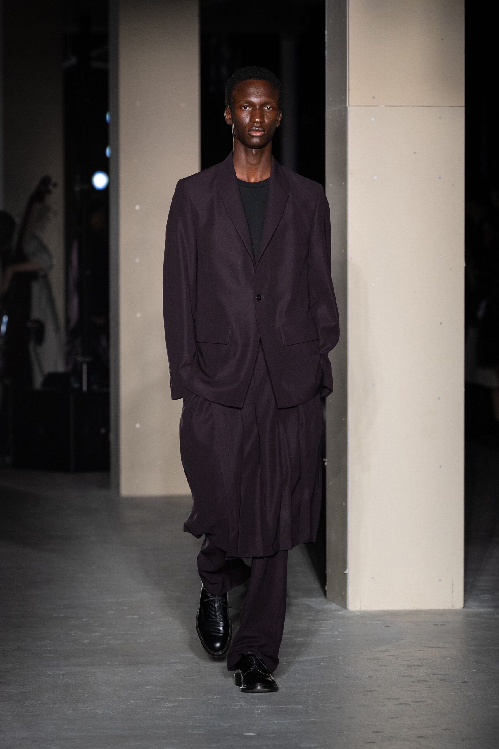 purple relaxed suit with black shoes
