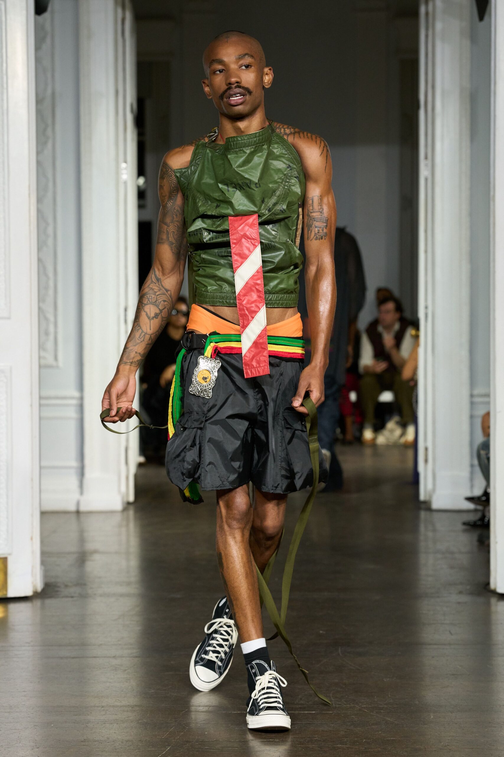 green vinyl sleeveless fitted top
