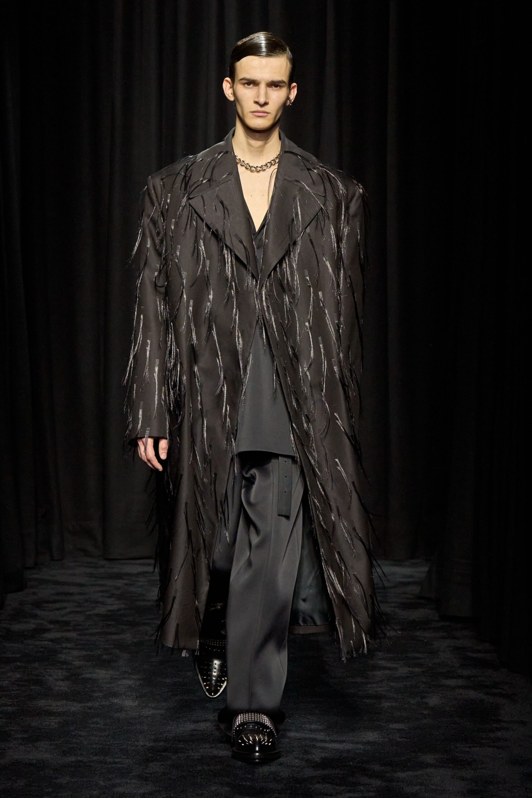 black oversized coat with fringe