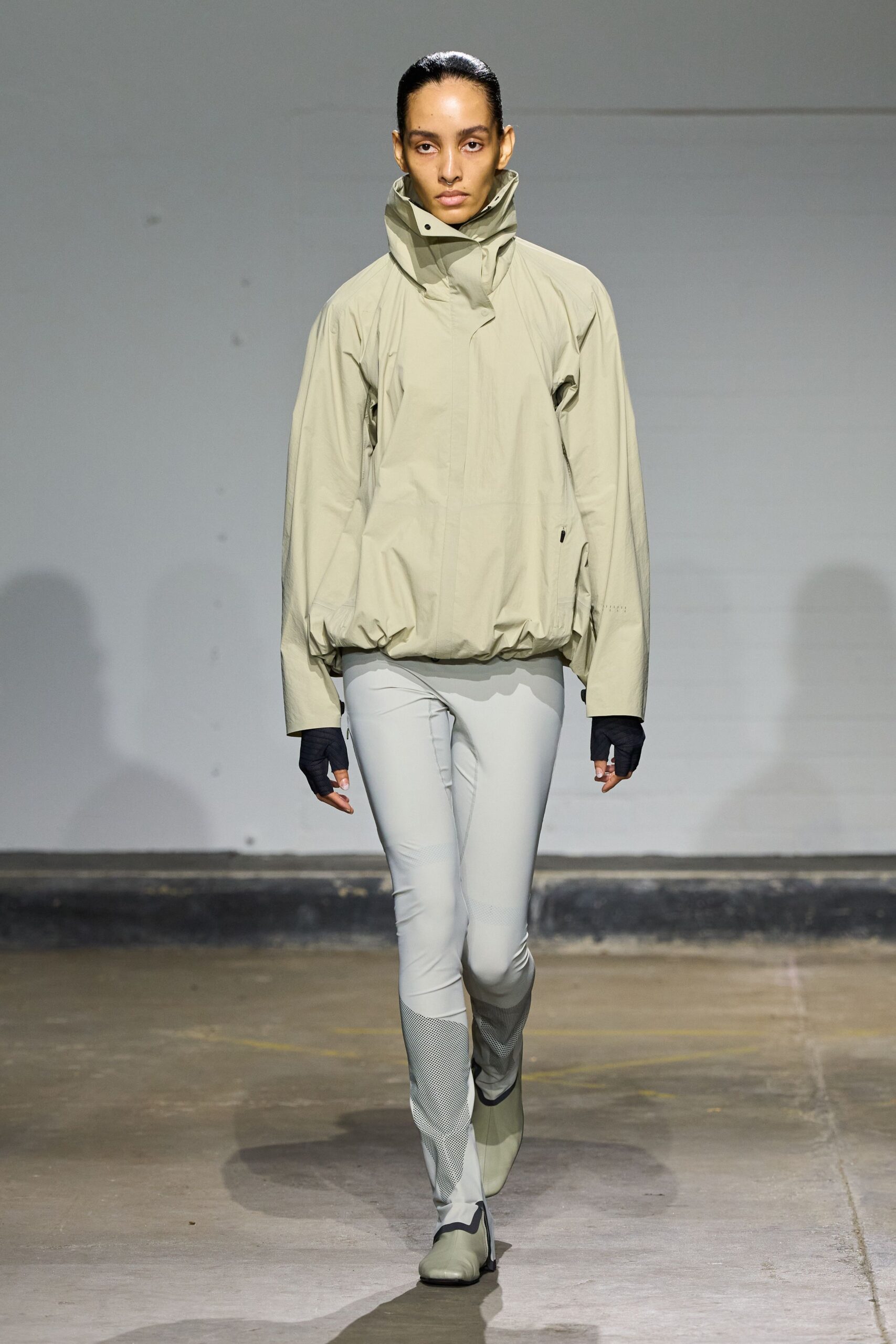 beige relaxed jacket with gray fitted pants
