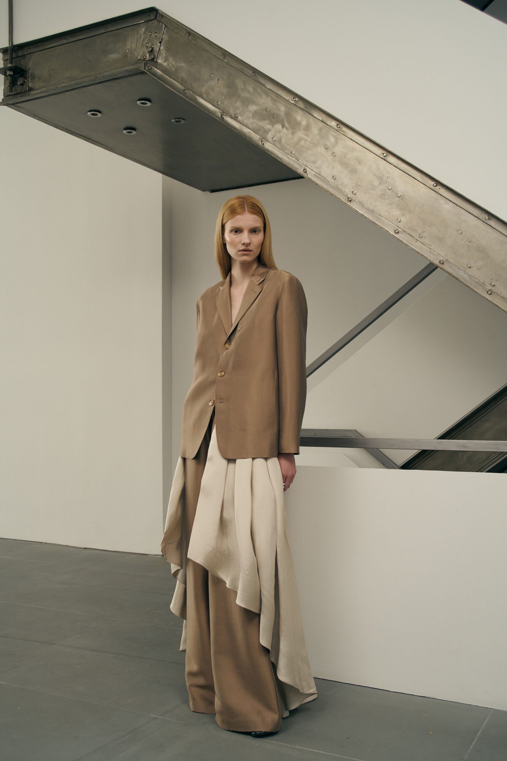 beige tailored blazer with layered pants