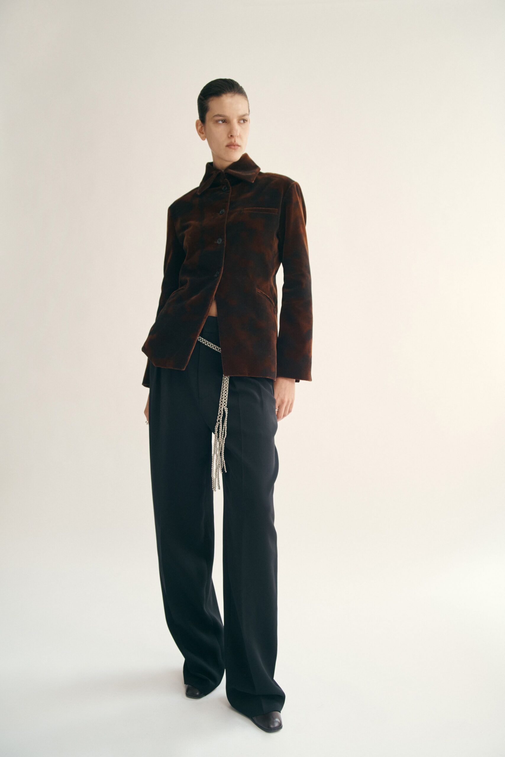 brown velvet relaxed jacket with black tailored pants
