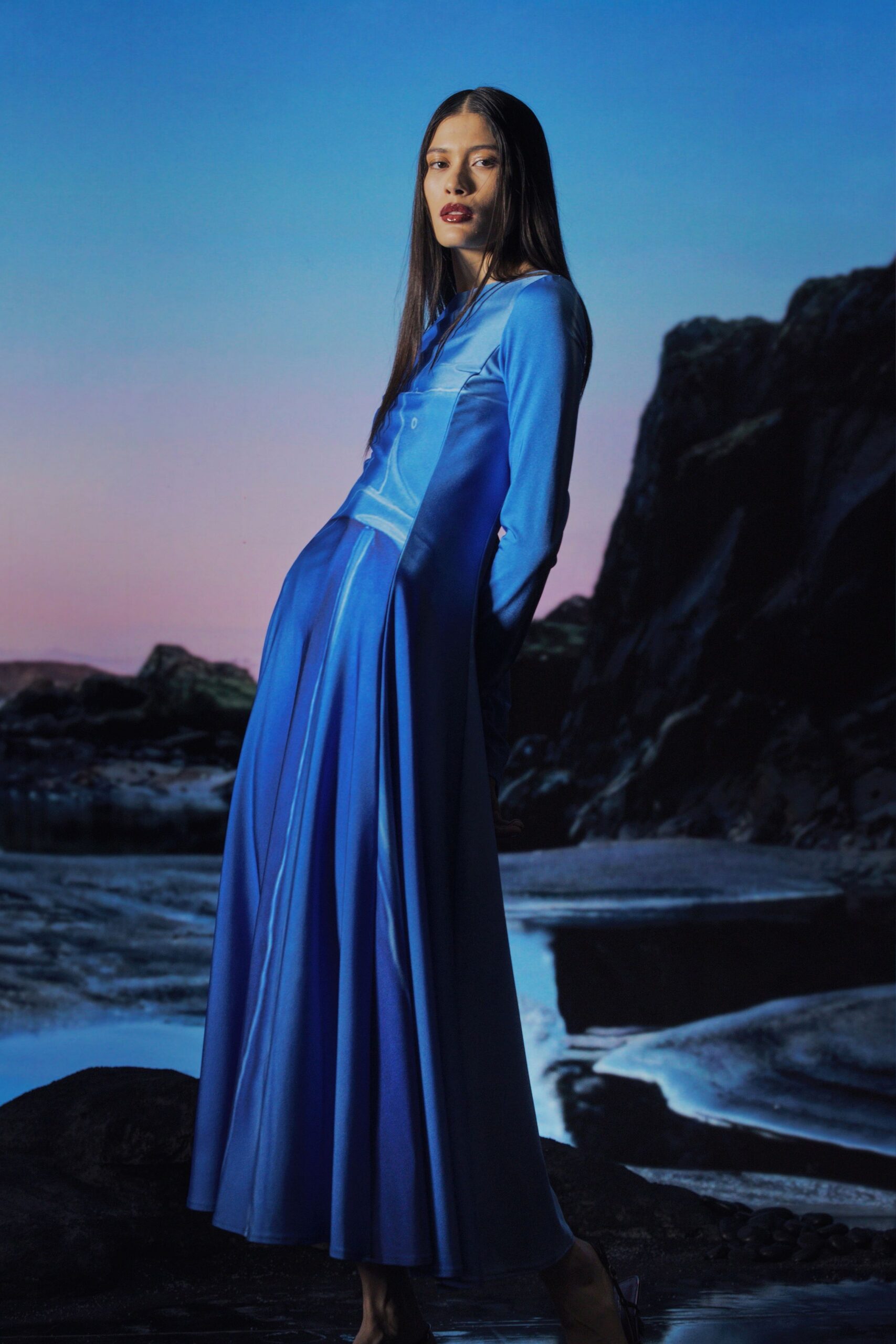 blue silk long-sleeve v-neck fitted pleated maxi gown
