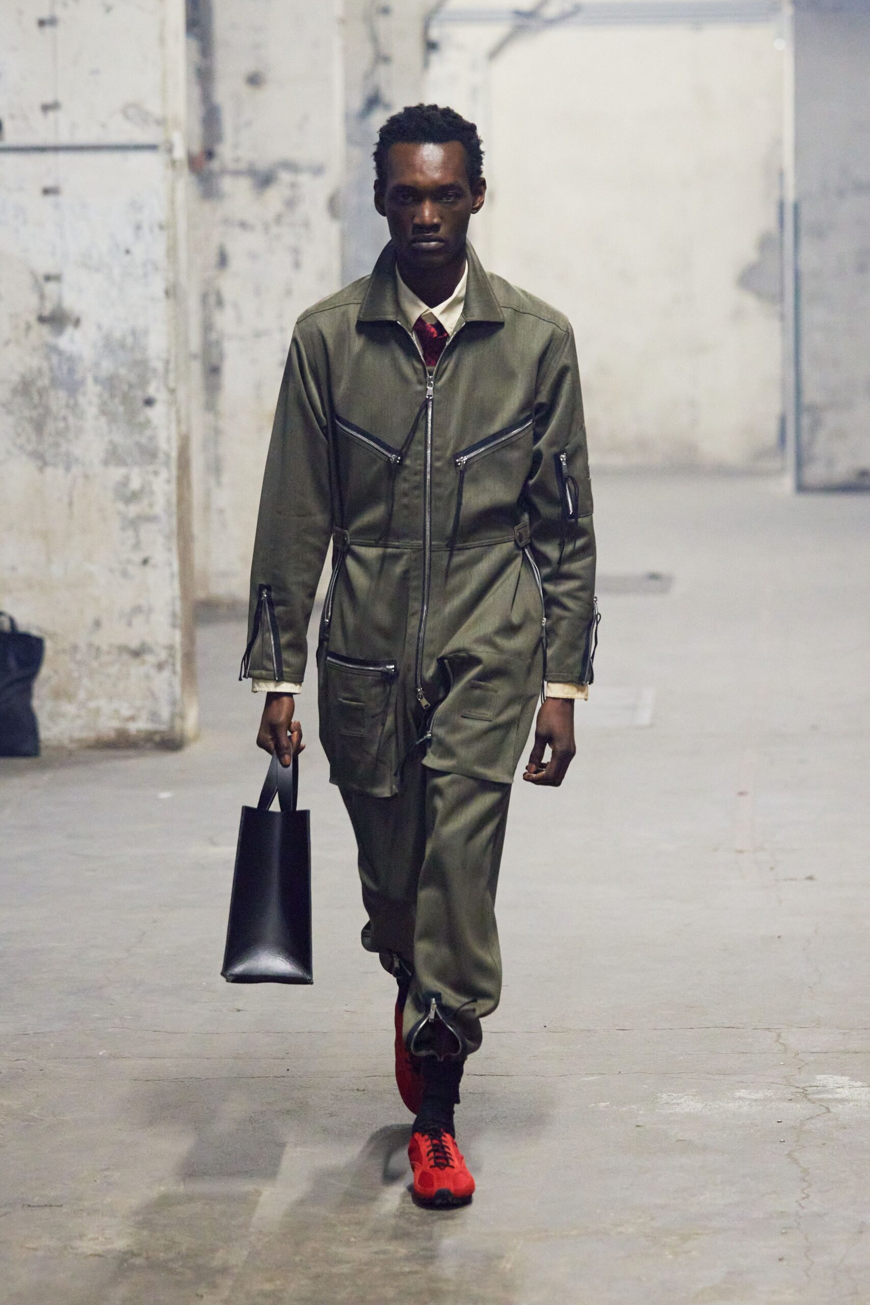 green fitted jumpsuit with red shoes