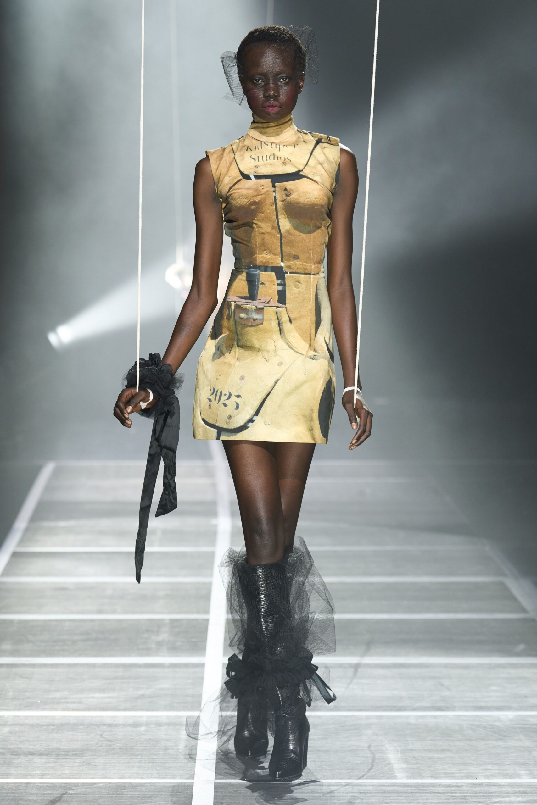fitted yellow printed mini dress with black boots