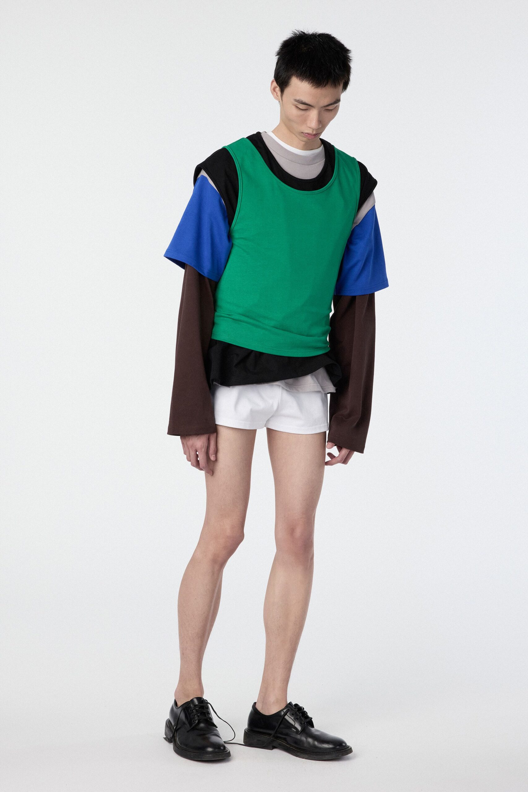 green and blue relaxed top with white shorts