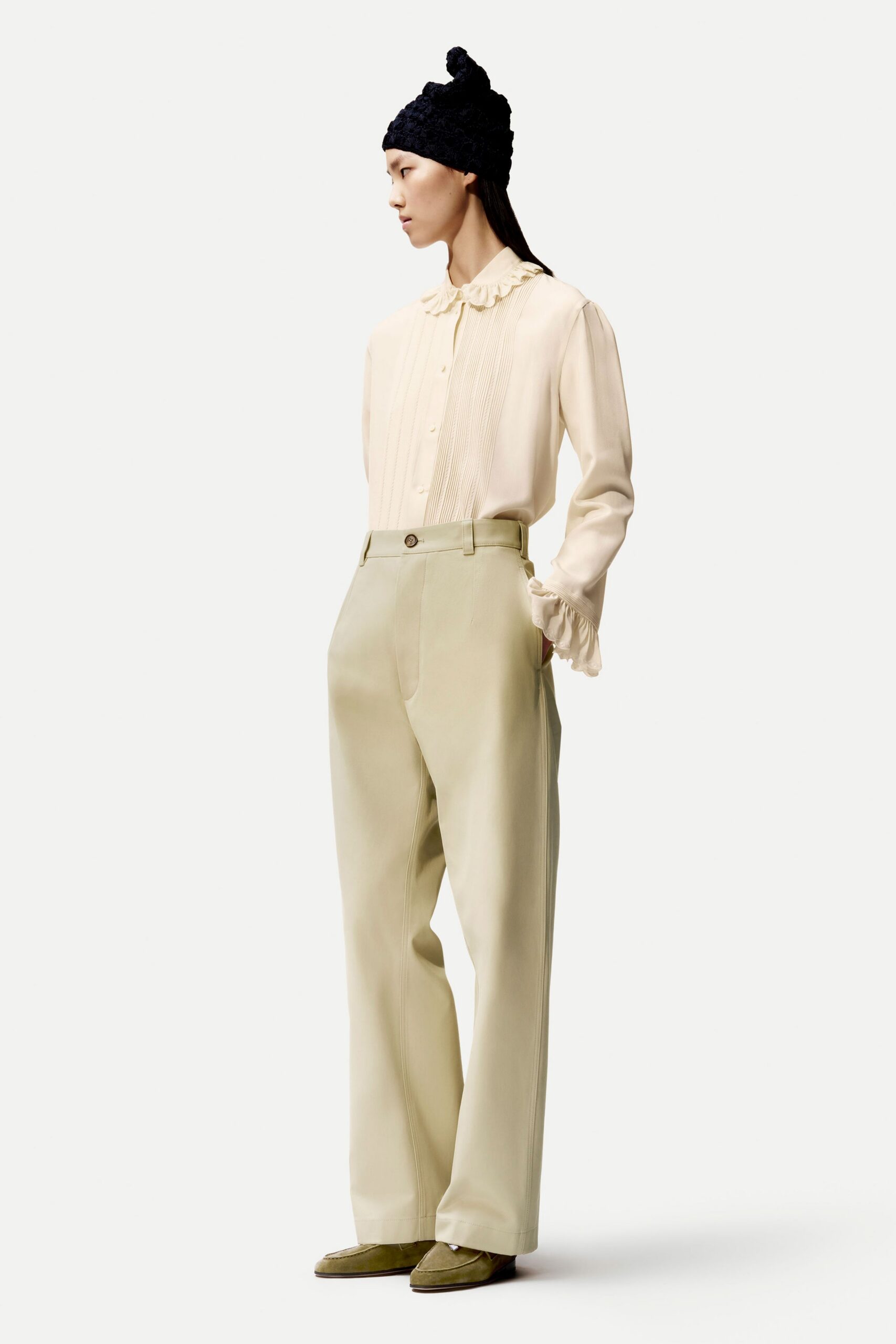 beige silk shirt with tailored pants