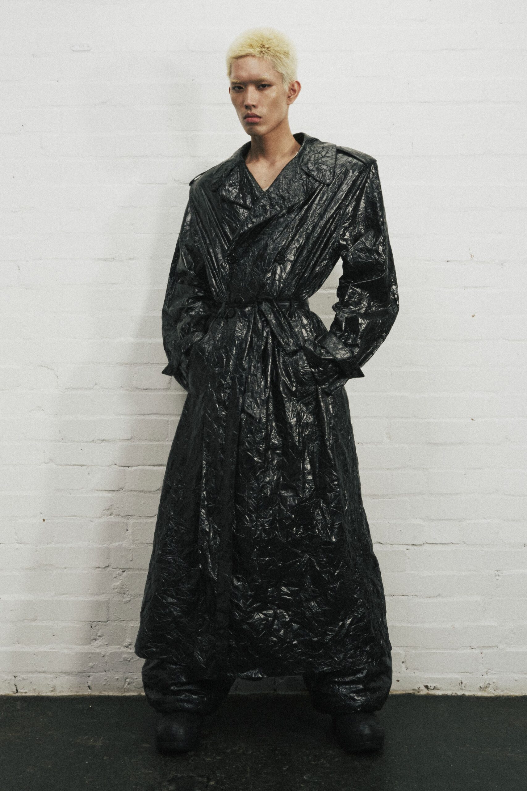 black vinyl long-sleeve collared oversized belted pleated coat