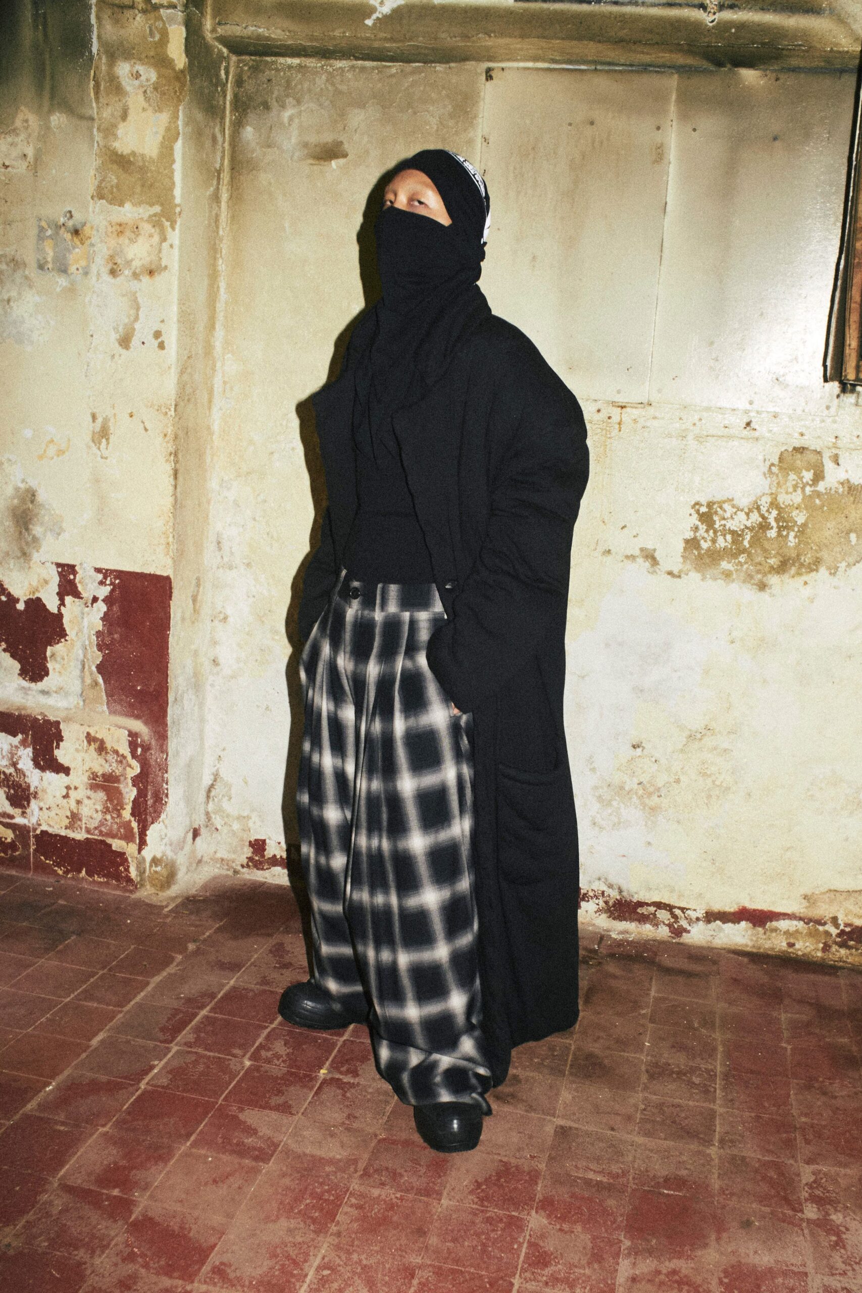 black wool coat with checked pants