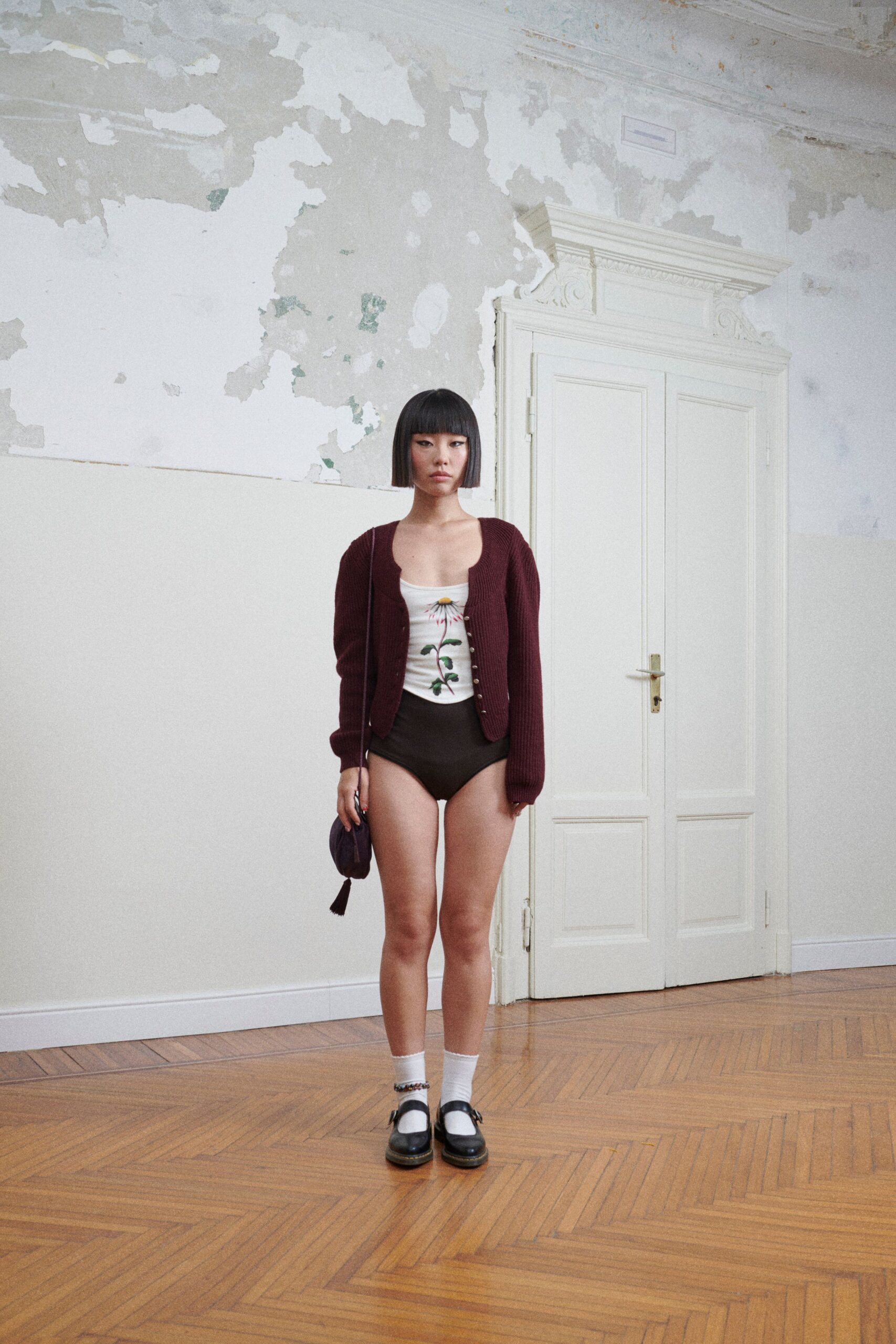 maroon cardigan white bodysuit black shorts