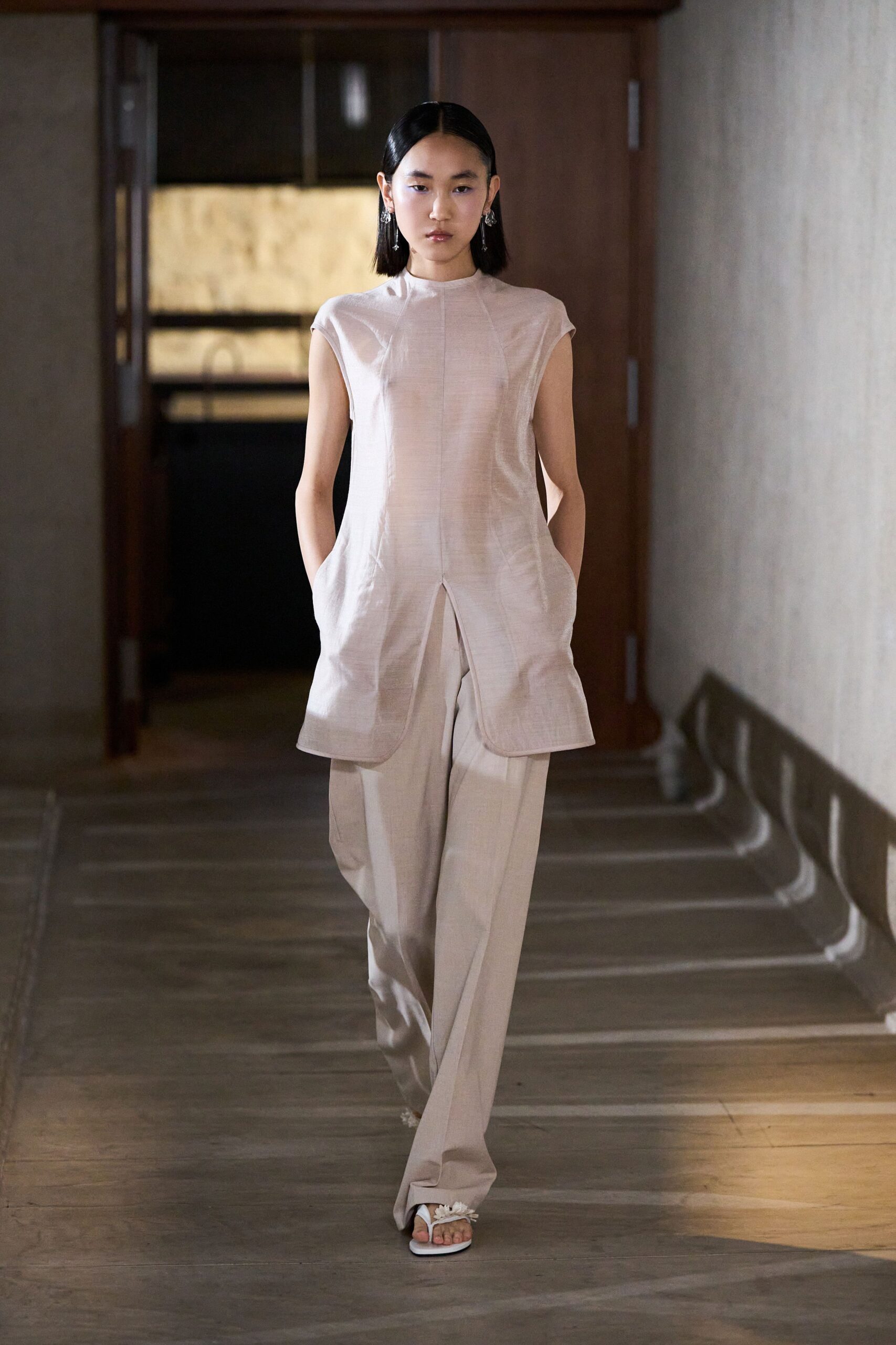 beige sleeveless top with tailored pants