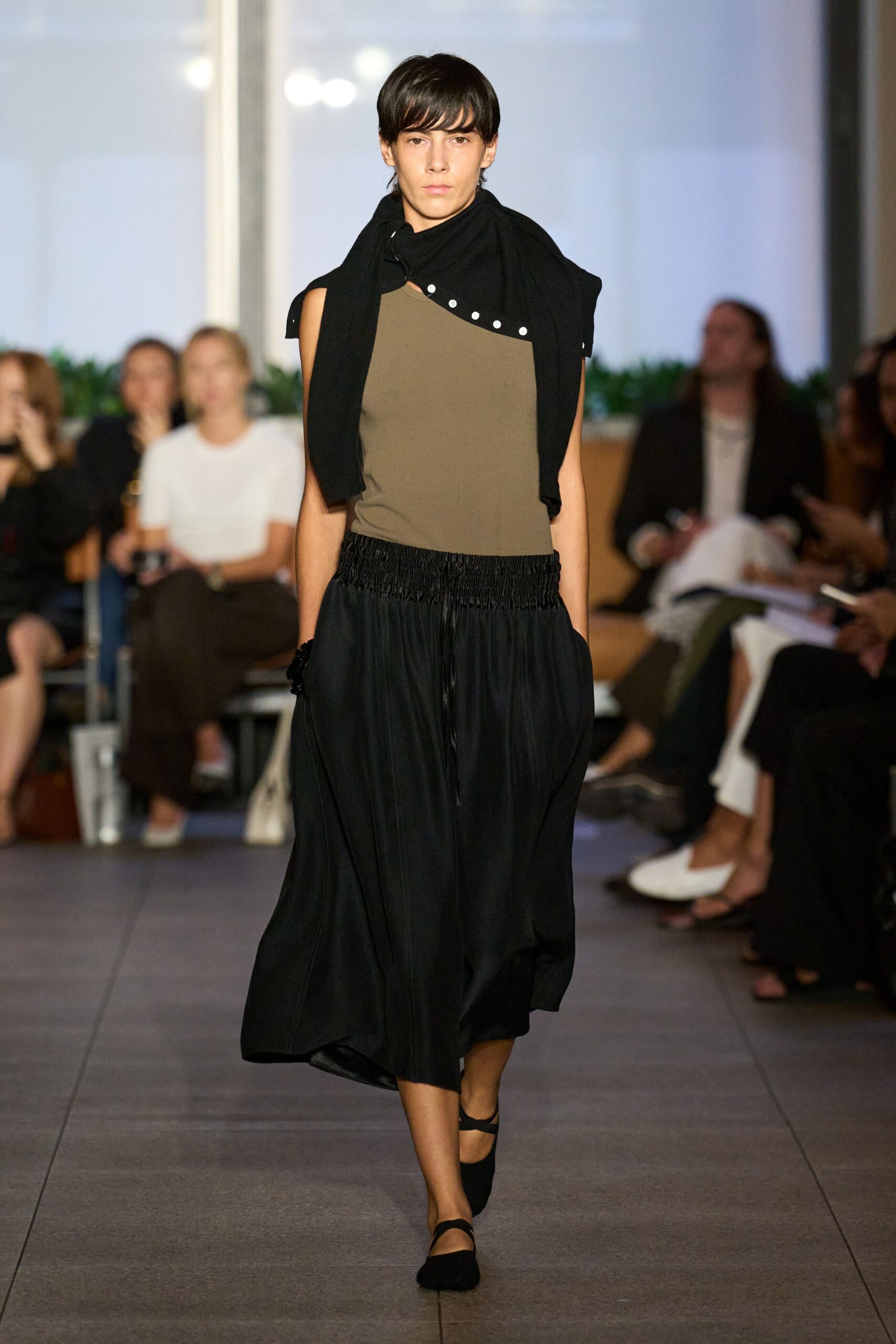 brown fitted top with black skirt