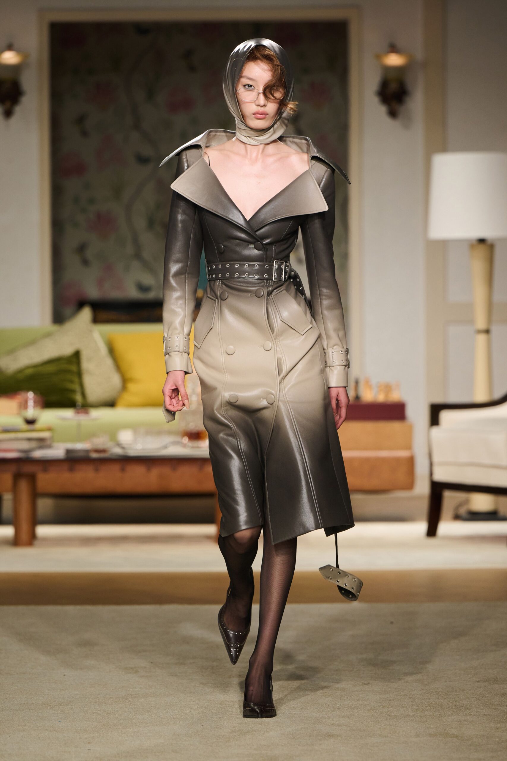 black leather long-sleeve collared fitted zippered belted trench