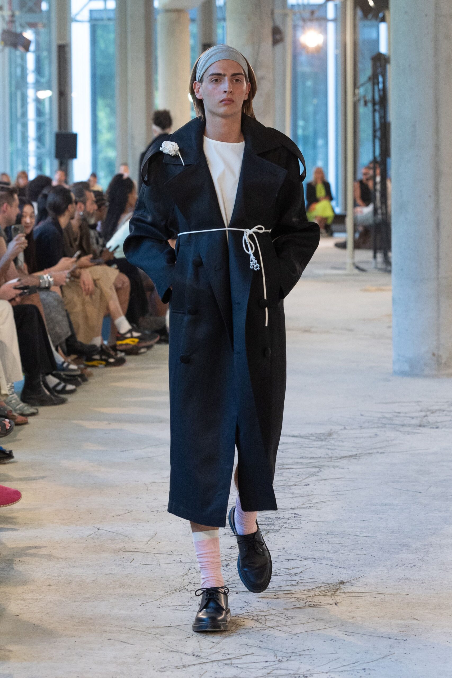 black coat white top black shoes