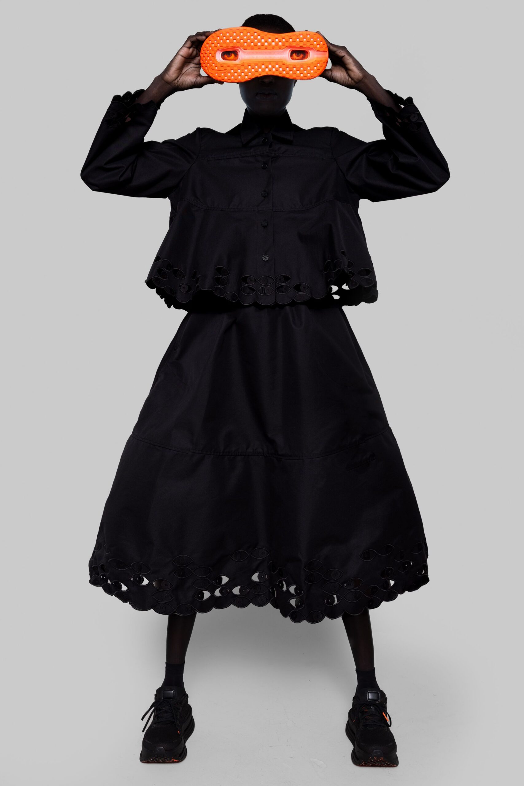 black relaxed top with midi skirt