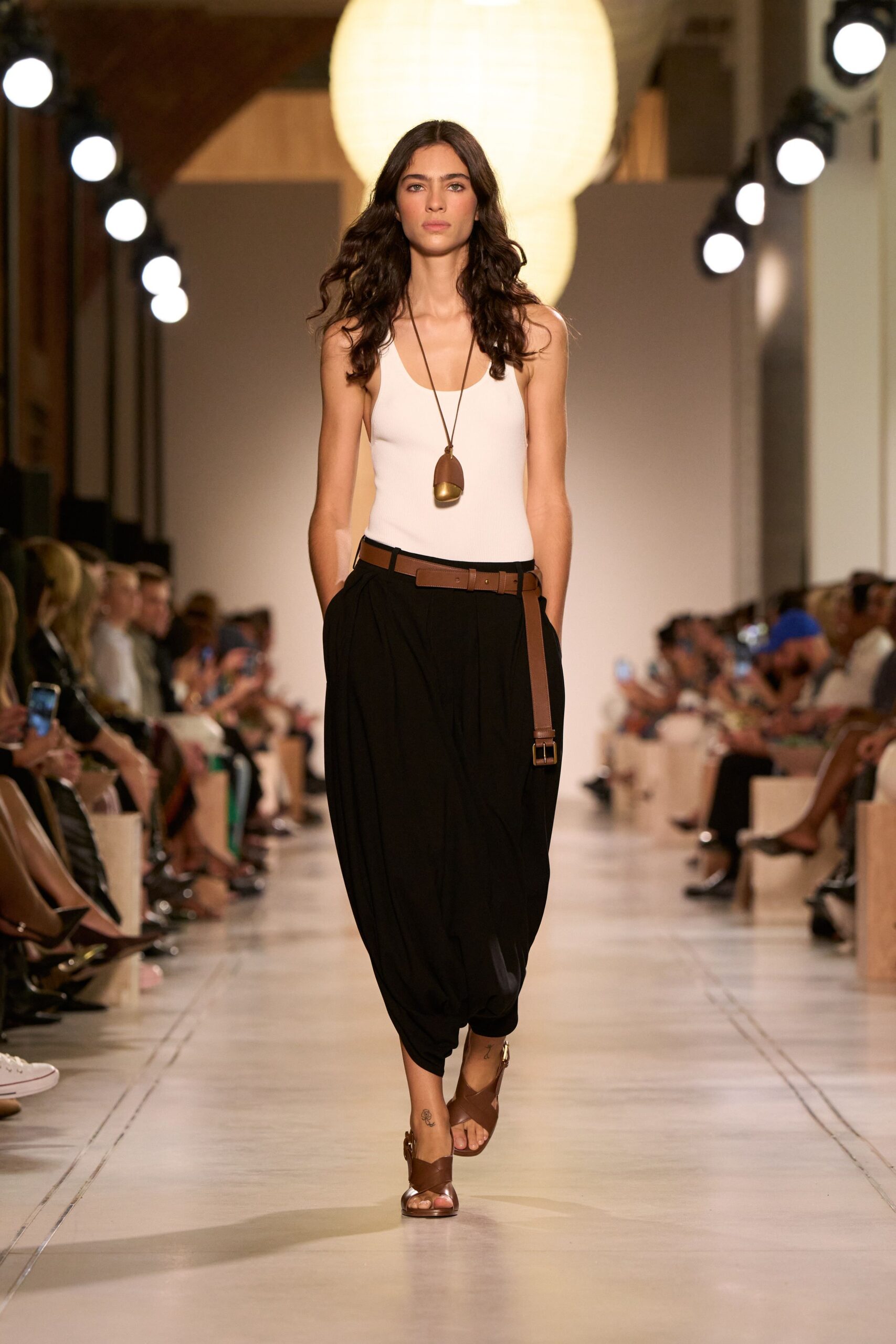 white fitted top with black relaxed pants