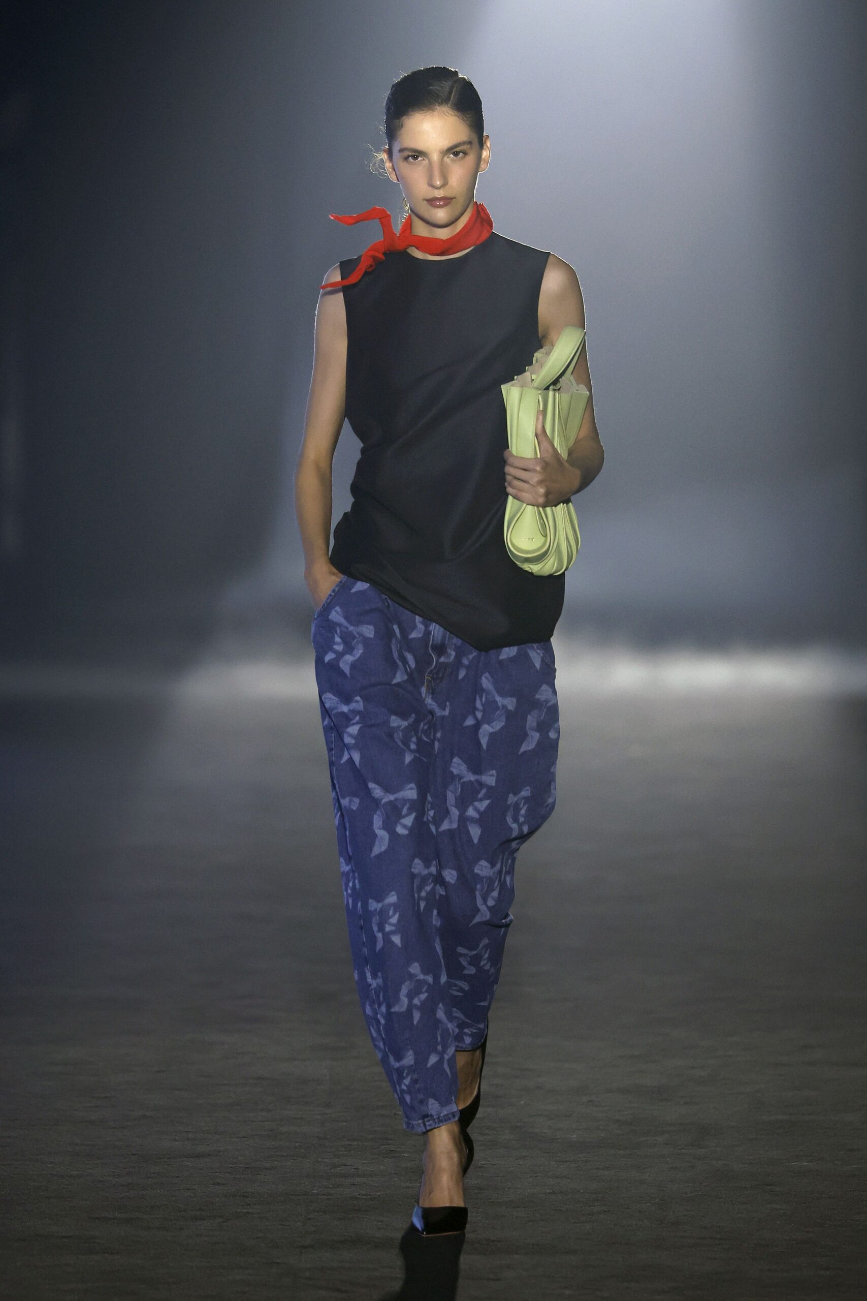 black relaxed sleeveless top with camo pants