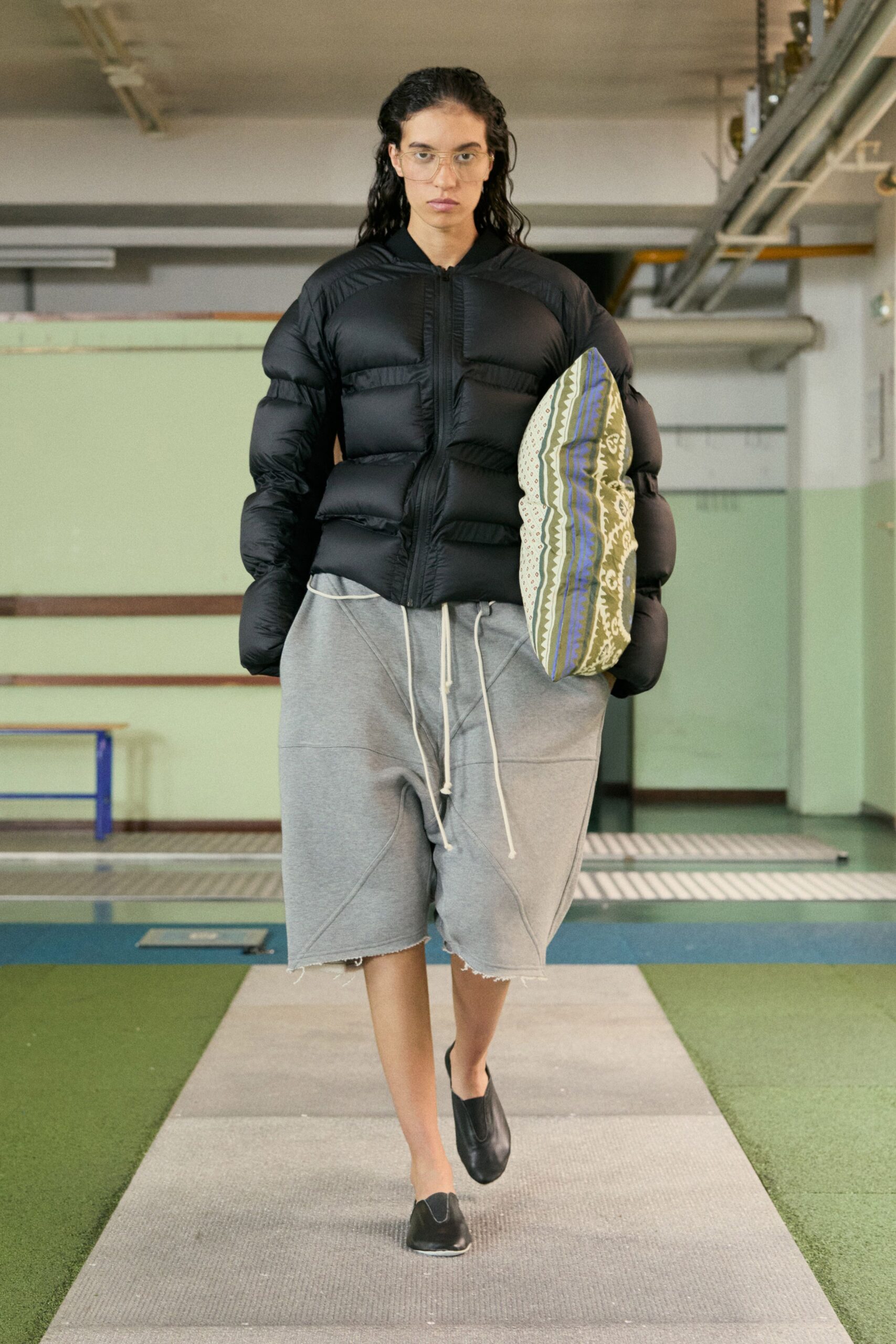 black padded jacket gray shorts